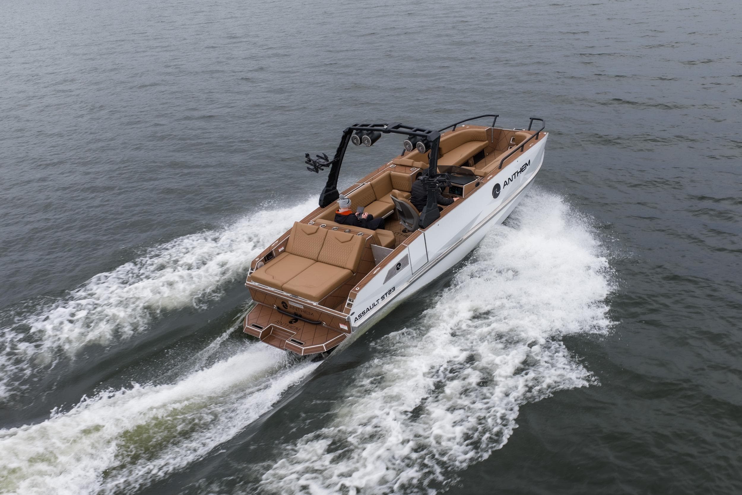 2026 Anthem Assault ST23 boat cruising on open water, rear view.