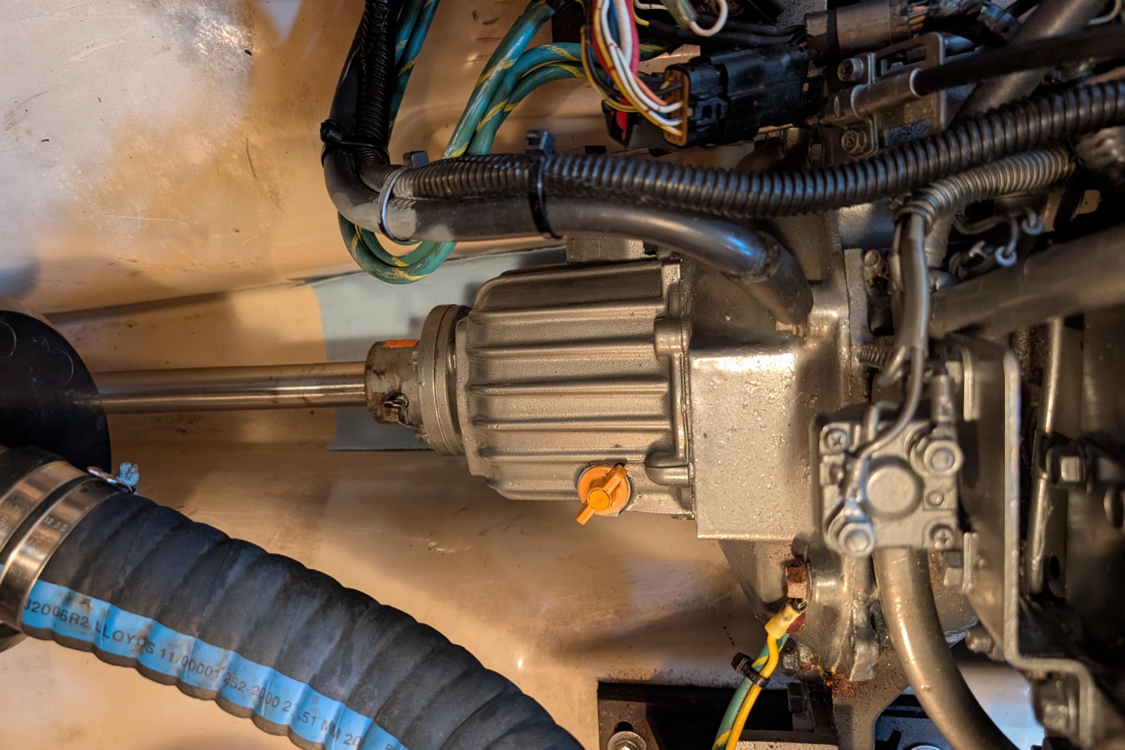 Engine compartment of a 1999 Island Packet 320 sailboat, showing mechanical components and wiring.