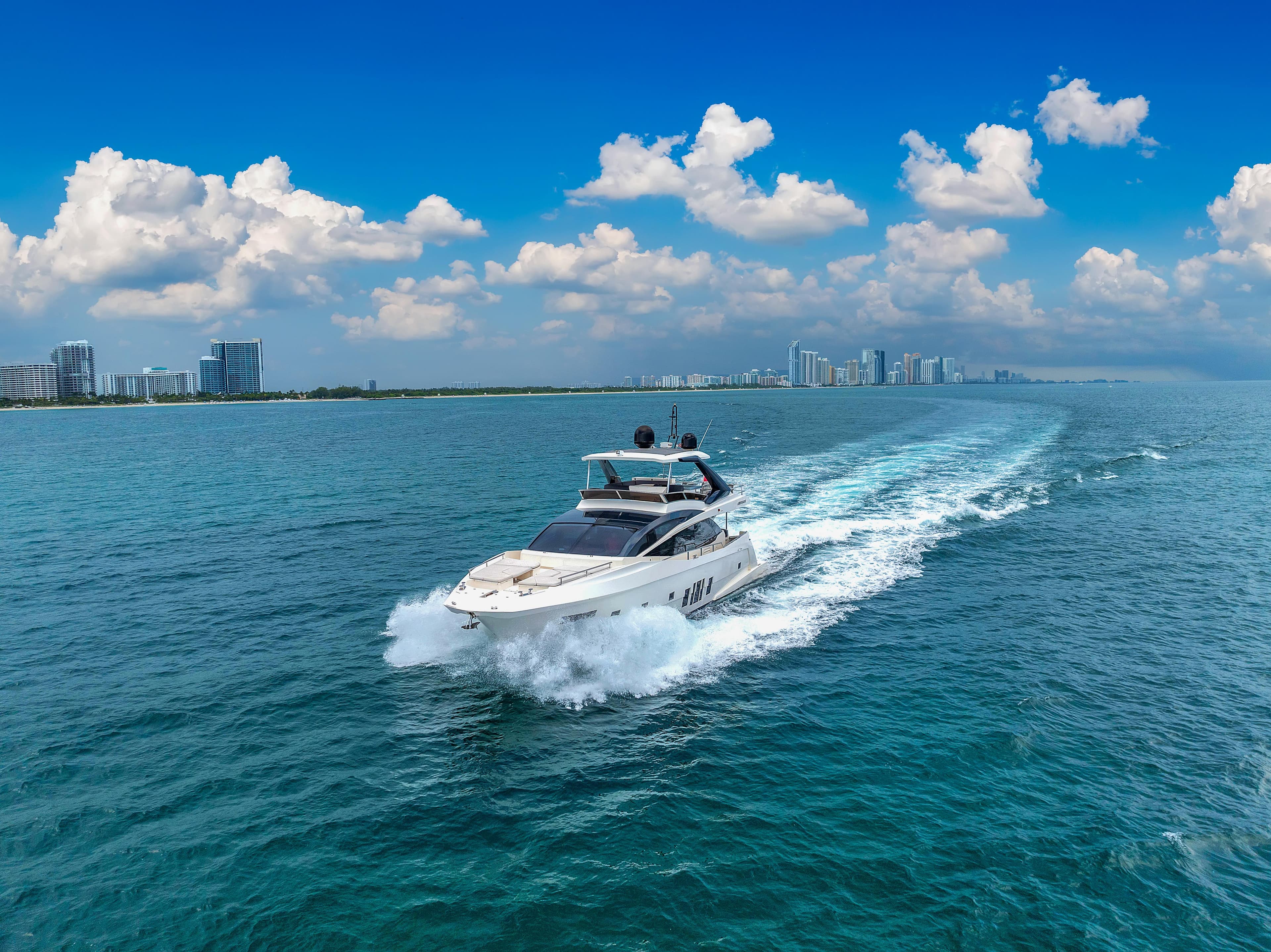 Astondoa 72 GLX yacht cruising on blue ocean under clear sky, 2013 model.