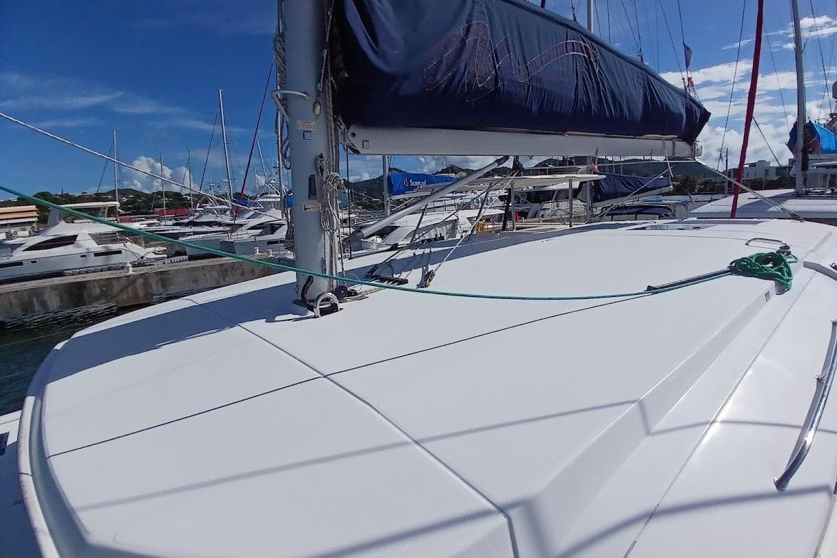 2020 Leopard 40 catamaran docked at marina under clear blue sky.