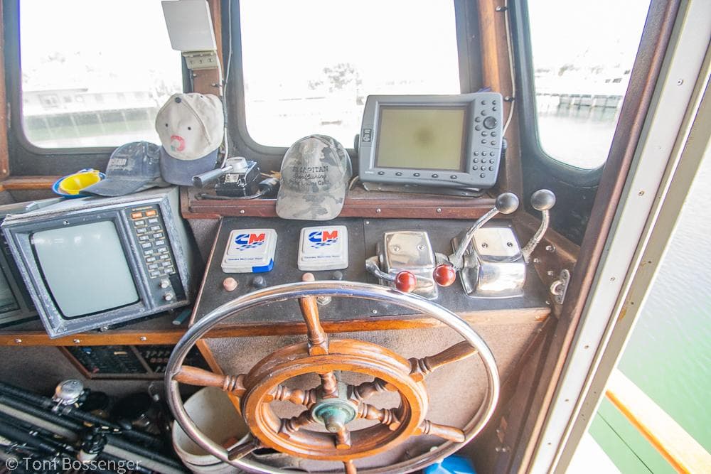 1975 Blanchard Passenger Sportfisher helm with vintage navigation equipment and steering wheel.
