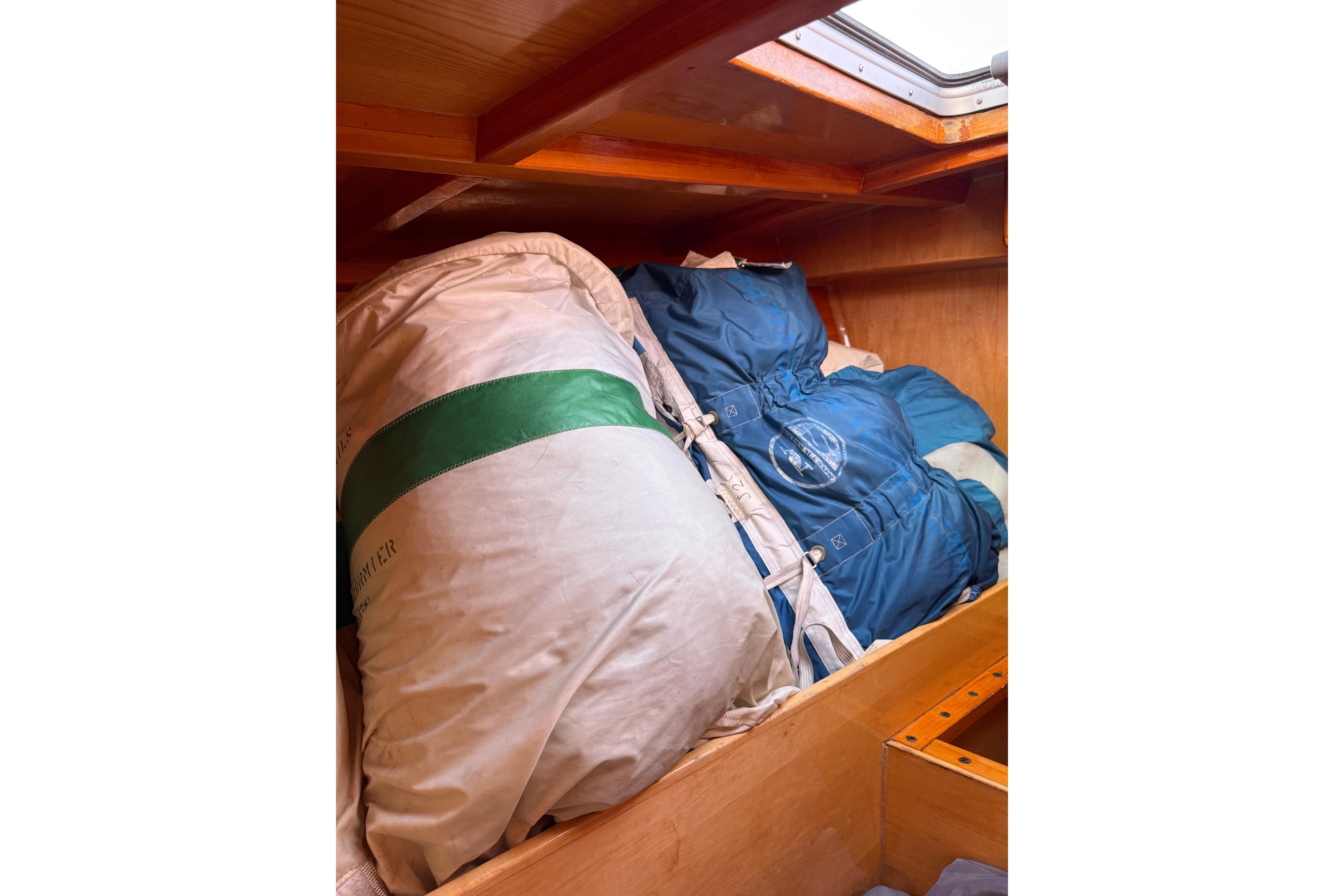 Storage area in a 2007 Chuck Burns Custom 49' Schooner with sails and gear.