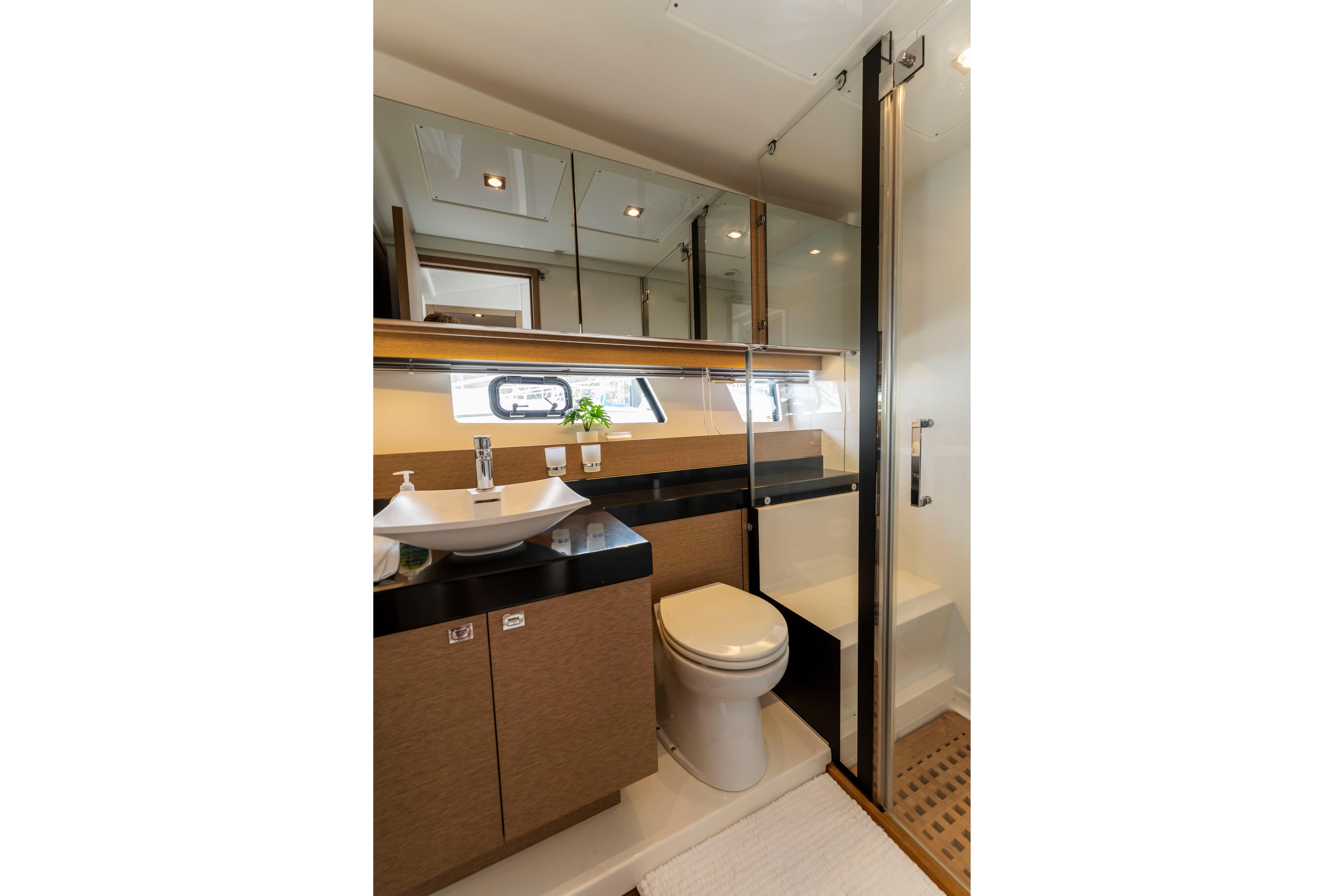 Luxurious bathroom in 2018 Prestige 560 yacht with modern fixtures and elegant design.