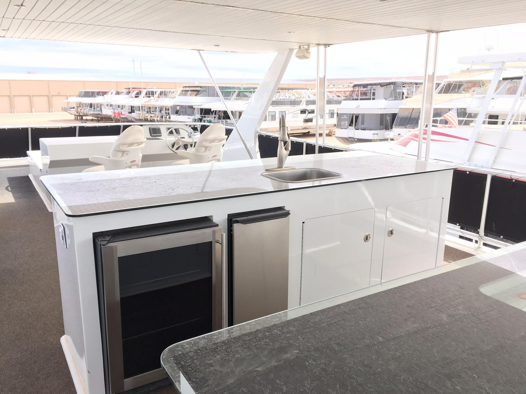 Luxurious Bravada yacht kitchen with sink and fridge, 2012 model.