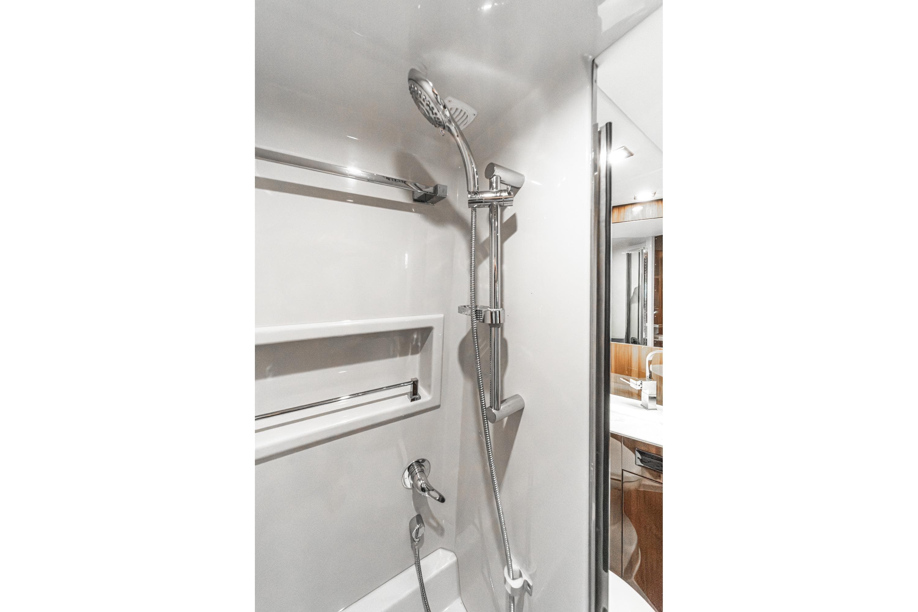 Luxurious shower in 2023 Cruisers Yachts 42 Cantius, featuring modern chrome fixtures.