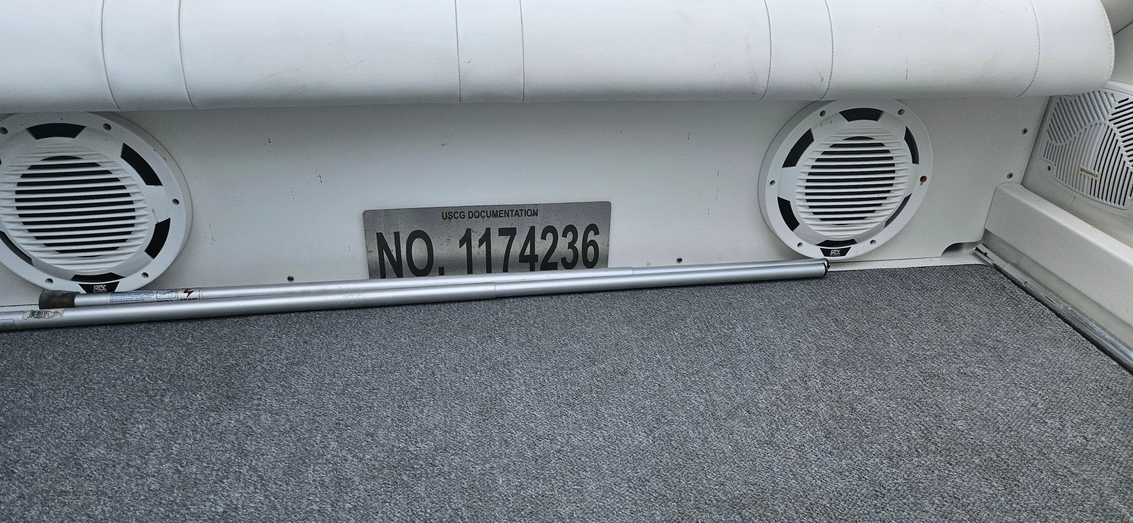 2004 Formula 382 FASTech boat interior with speakers and registration number.