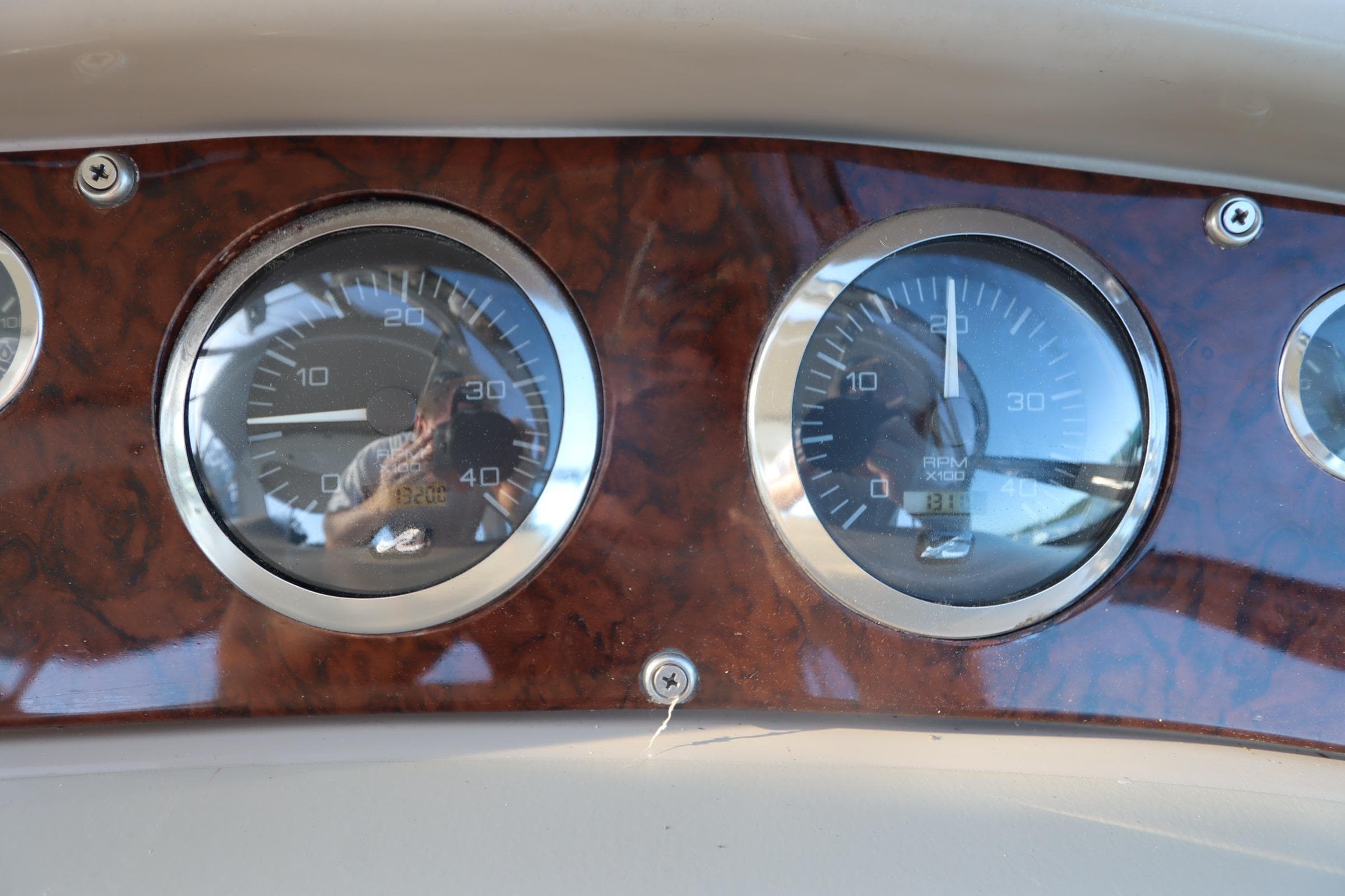 Dashboard gauges of a 2000 Sea Ray 460 Sundancer boat.