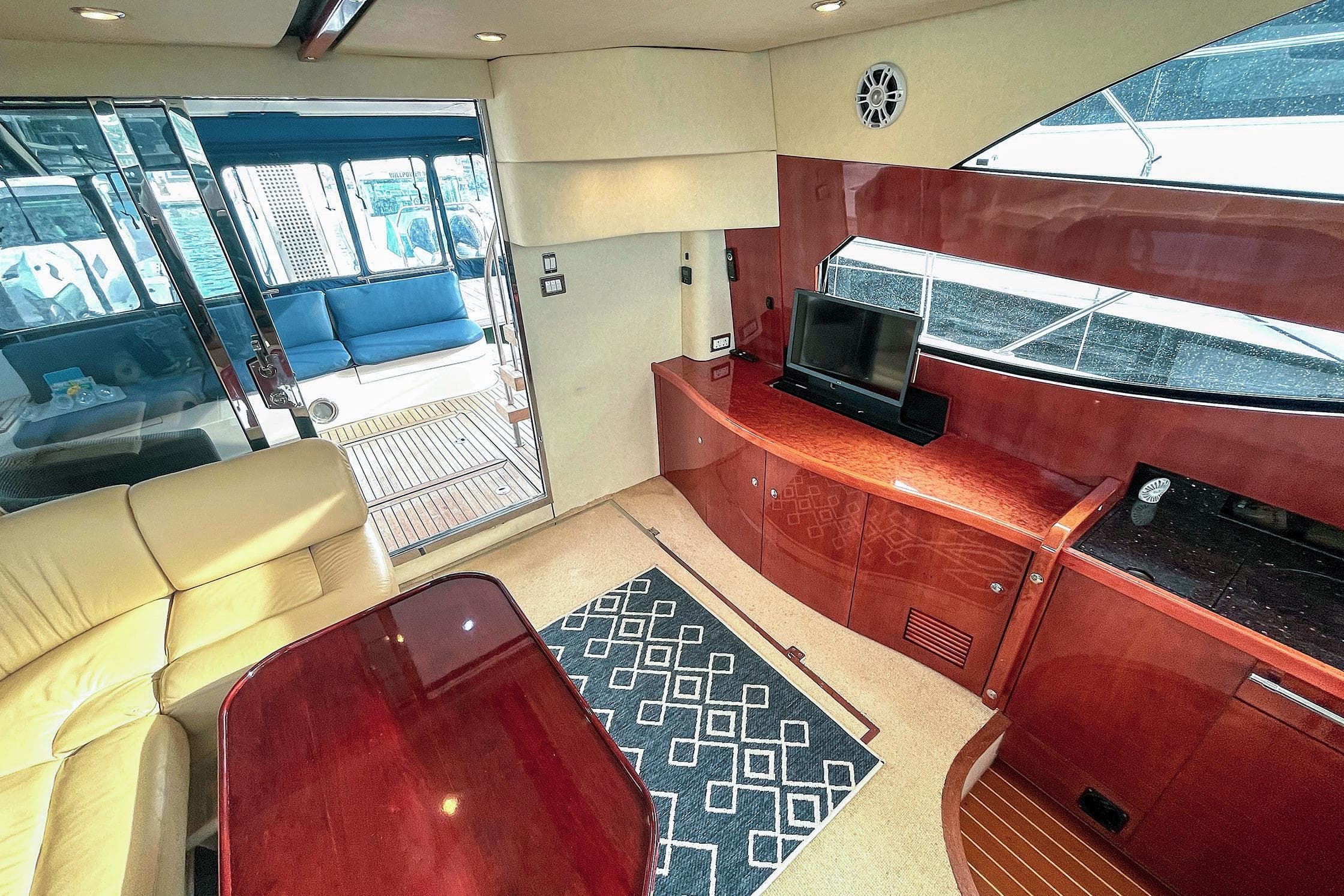 Luxurious interior of 2006 Fairline Phantom 46 yacht with elegant wood finishes and modern amenities.