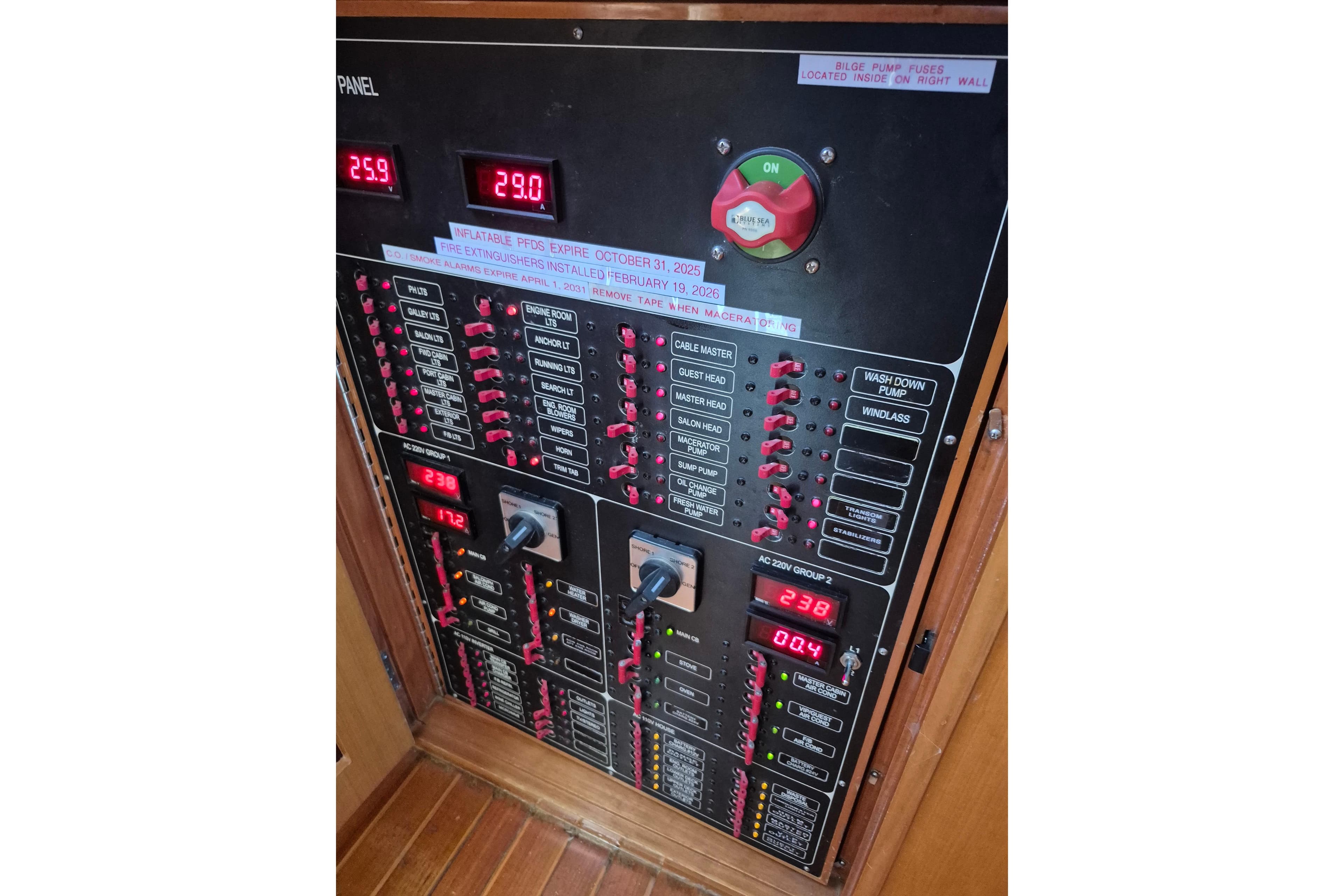 Electrical control panel on a 2006 Altima Flybridge boat, displaying various switches and readings.