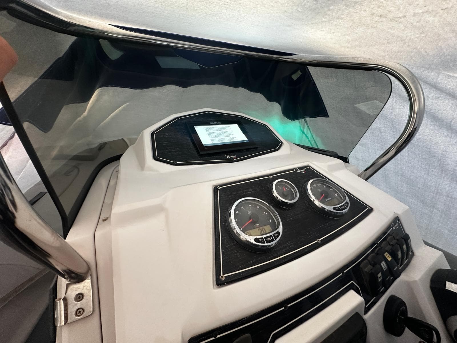 Control panel of 2021 Ranieri Cayman 26 boat with gauges and display.