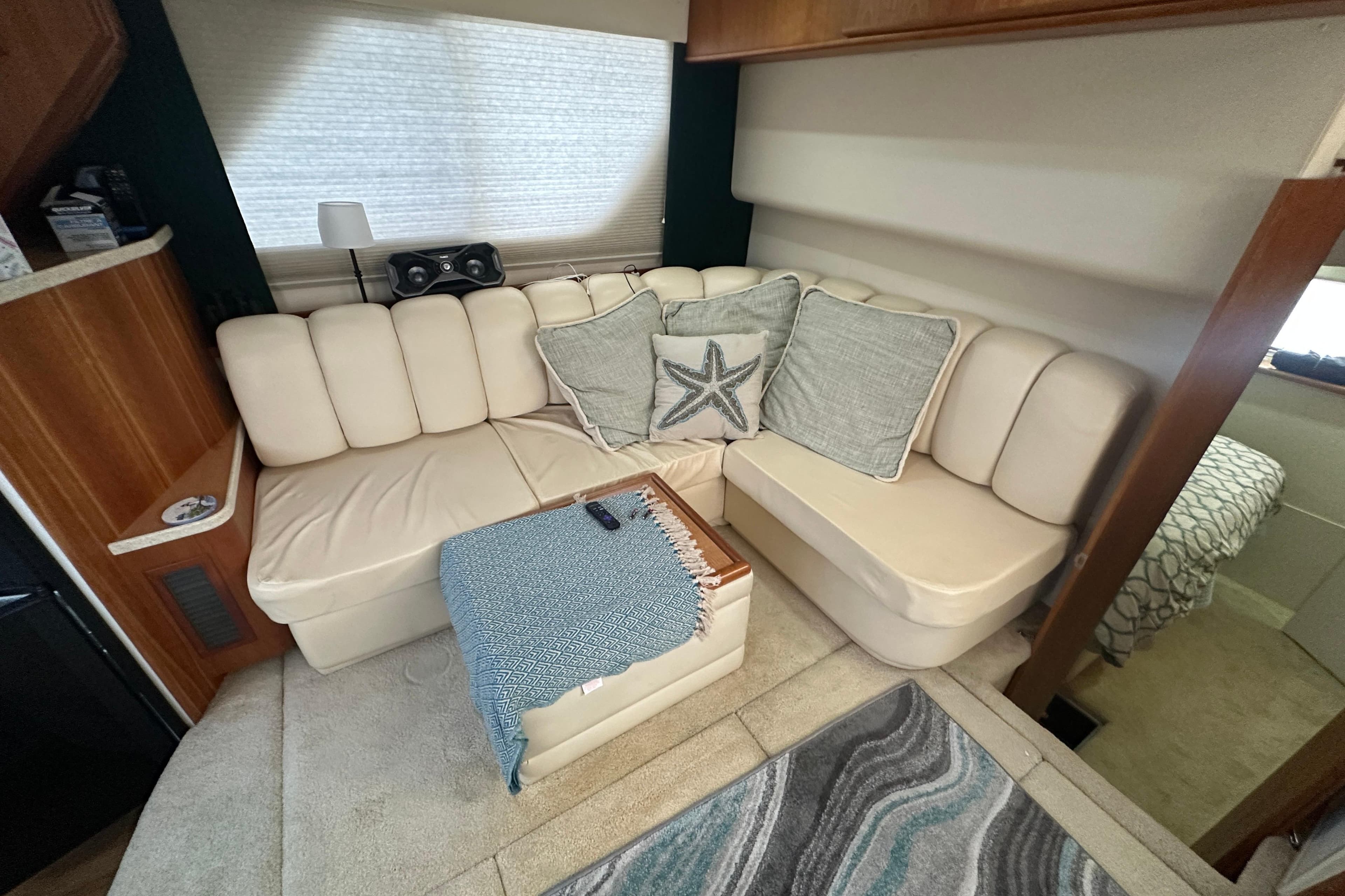 1998 Silverton 372 Motor Yacht interior with cozy seating and decorative pillows.