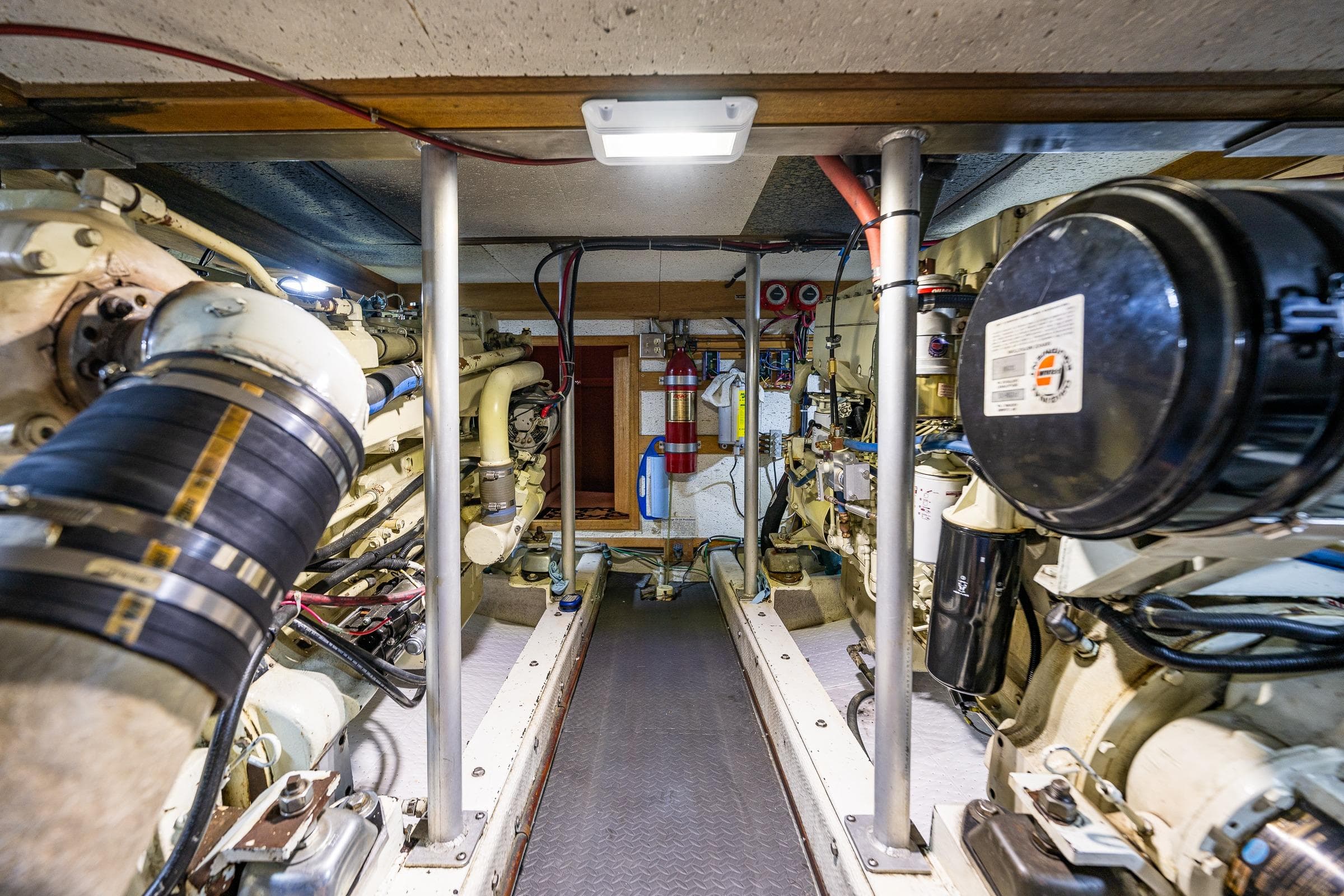 Engine room of a 1989 Nordic 52 boat, showcasing machinery and equipment.