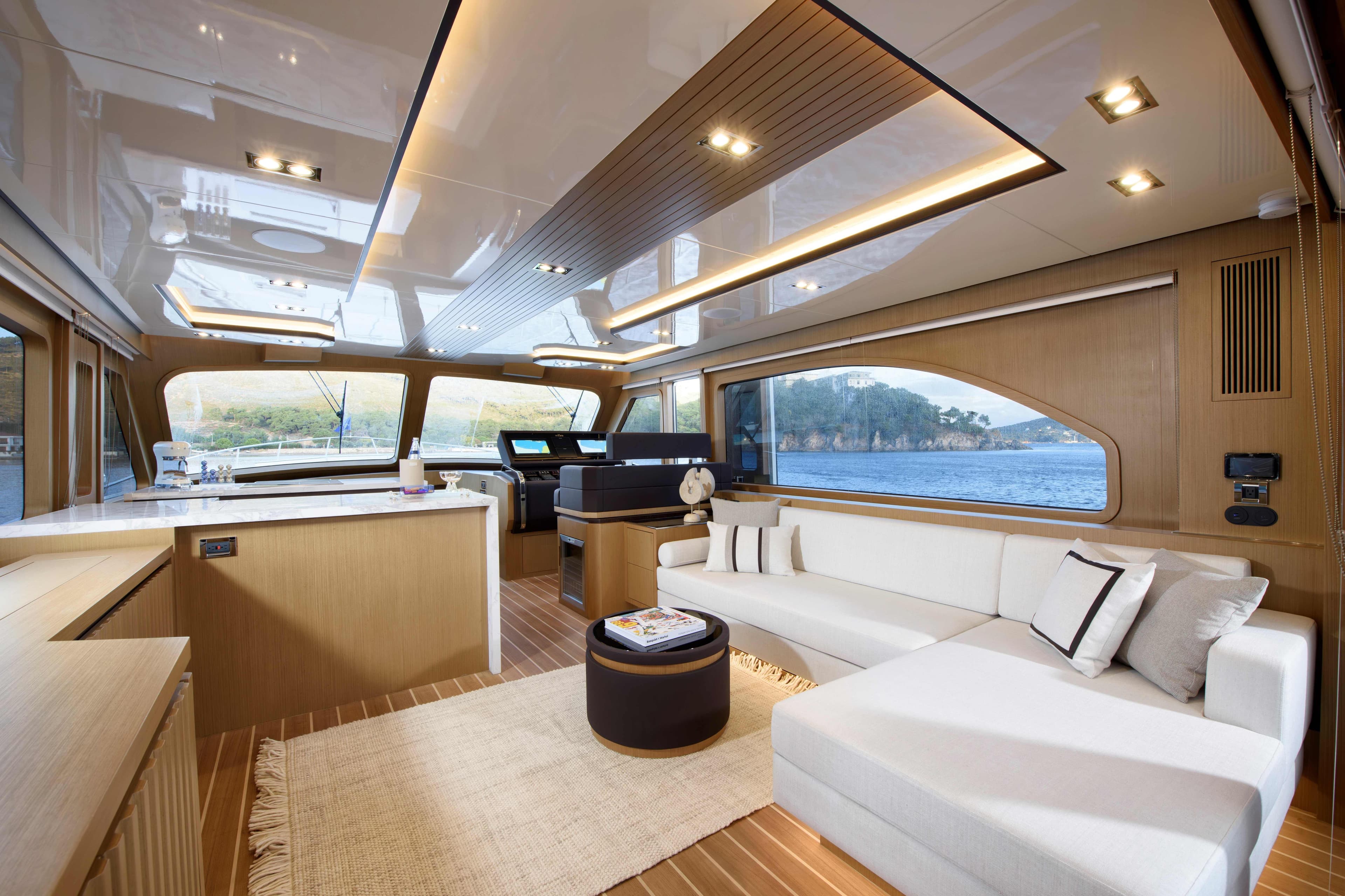 Luxurious interior of 2025 Vicem 65 Classic yacht with modern furnishings and panoramic windows.