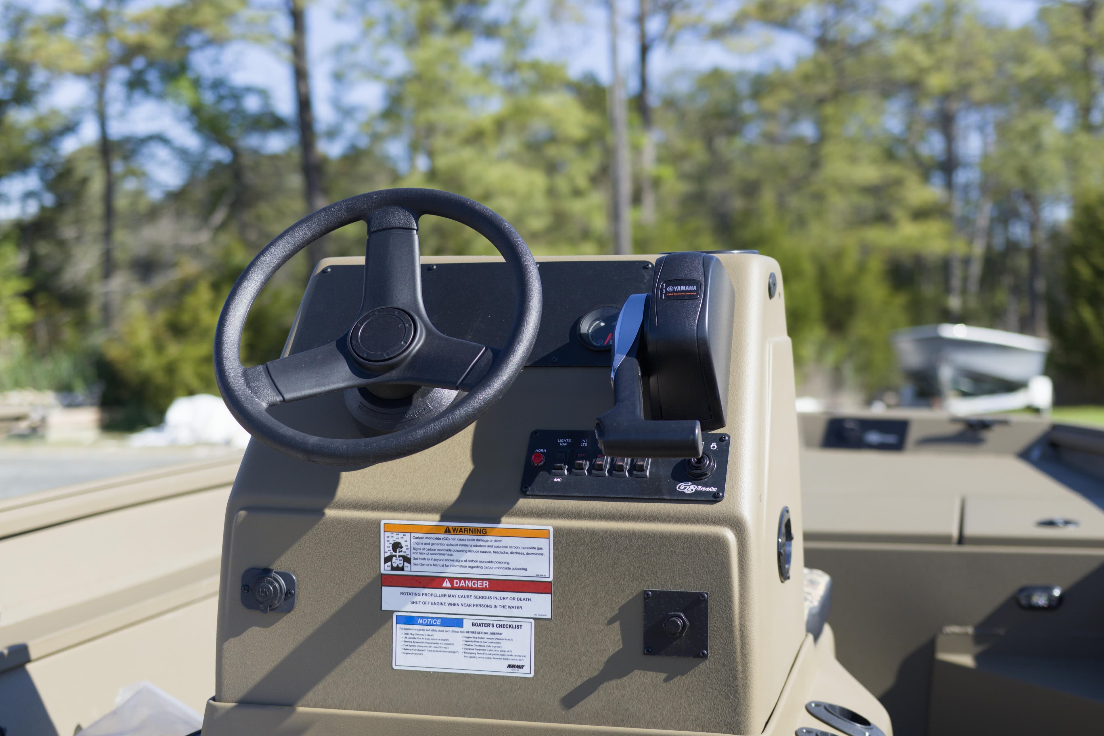 Steering console of 2026 G3 Gator Tough 18 CC boat, featuring controls and gauges.