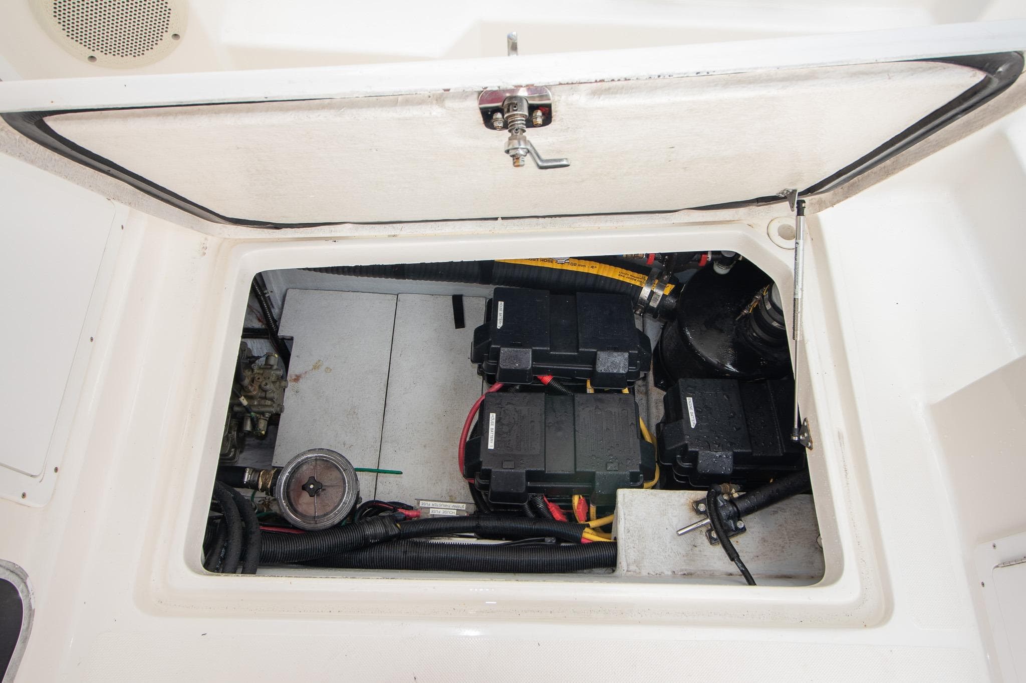 2013 Aspen C90 boat engine compartment with batteries and wiring visible.
