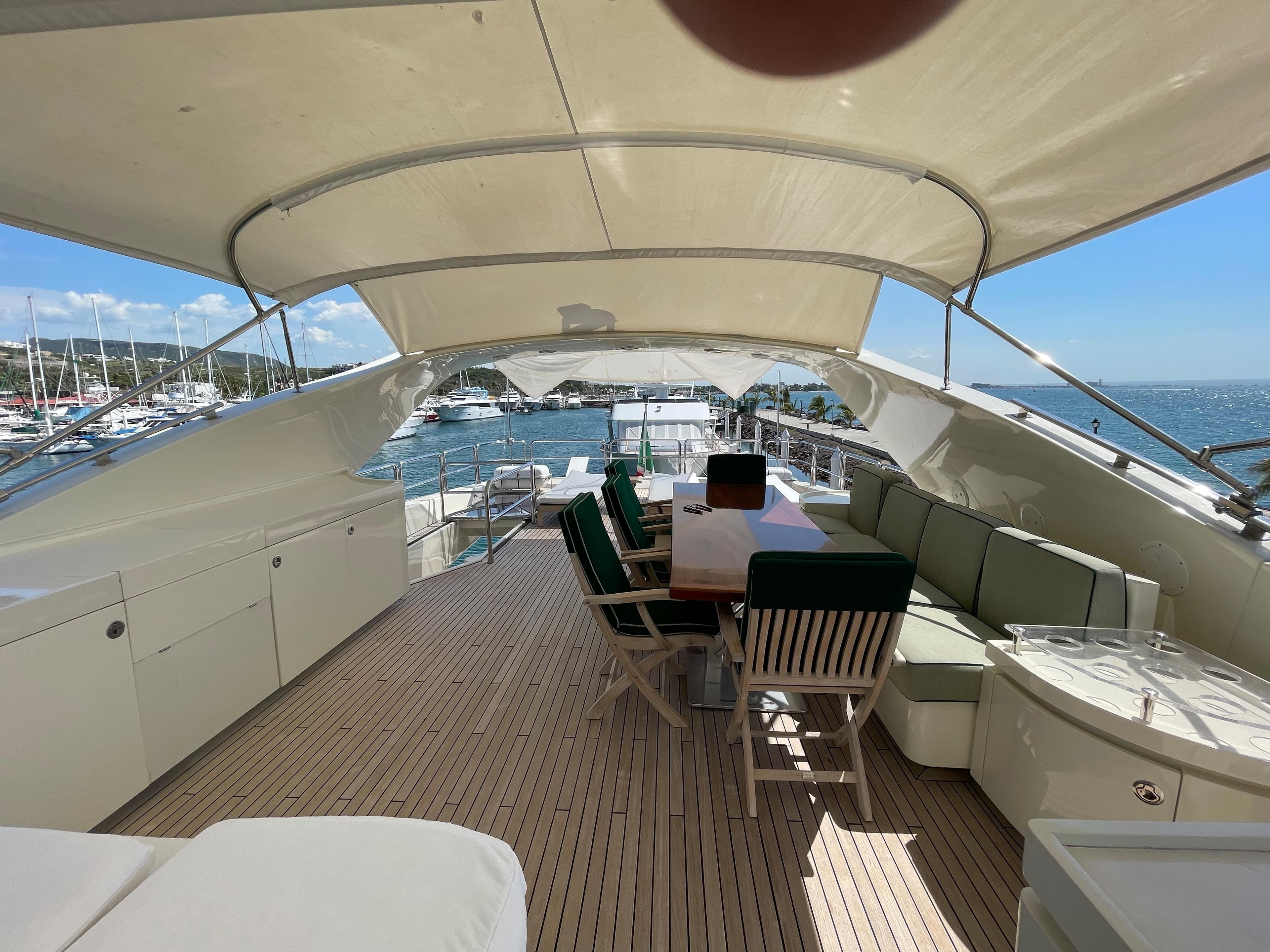 Luxury yacht Posillipo Technema 95, 2007 model, featuring spacious deck and seating area.