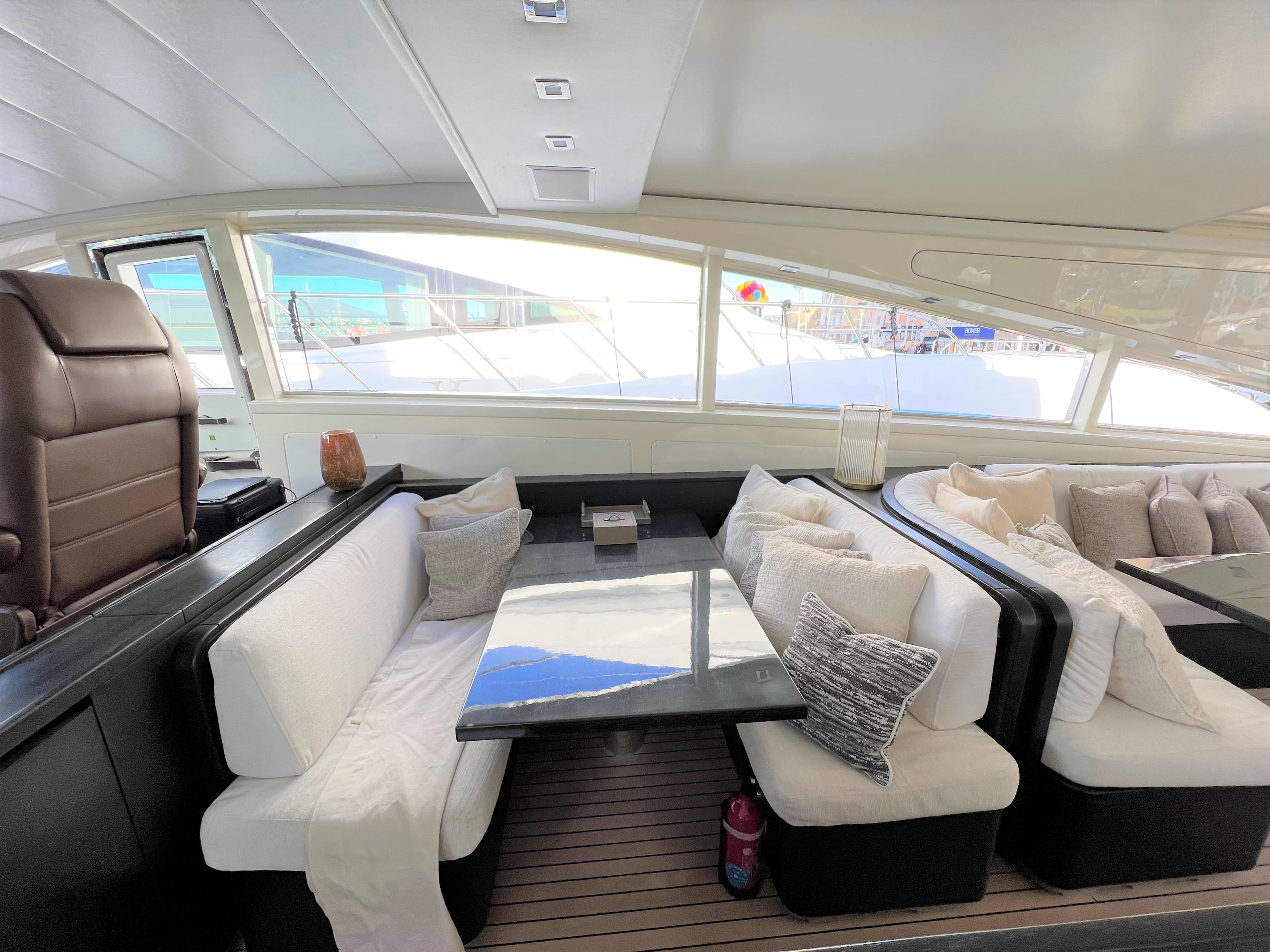 Luxurious interior of 2008 Arno Leopard 27 yacht with plush seating and elegant decor.