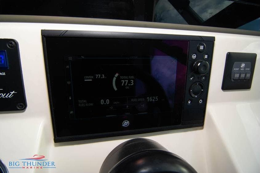 Dashboard of 2022 Scout 350 LXZ boat with digital display and controls.