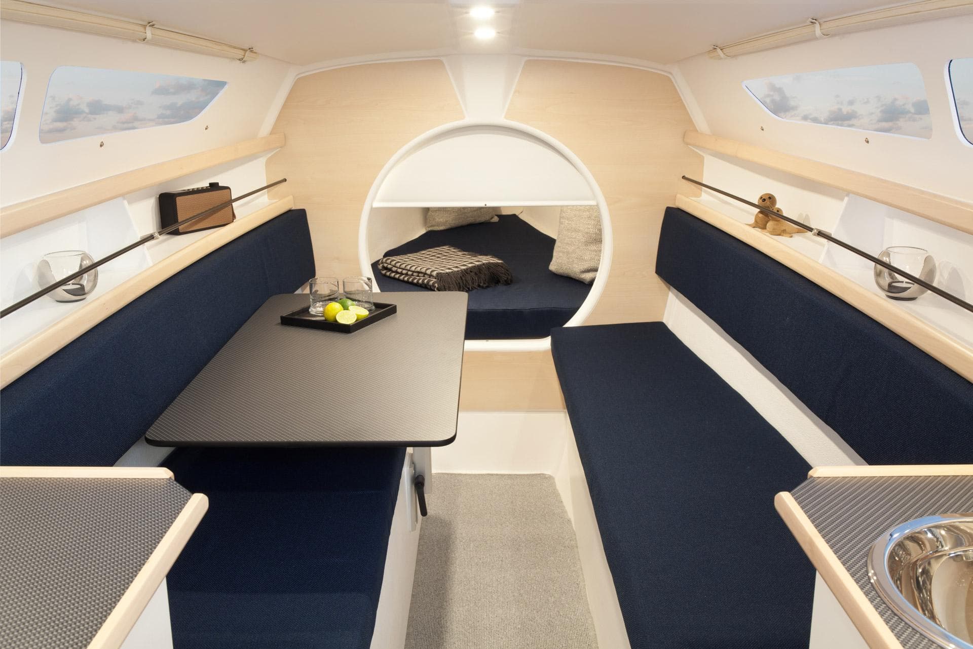 Interior of 2026 Dragonfly 25 sailboat with modern seating and dining area.