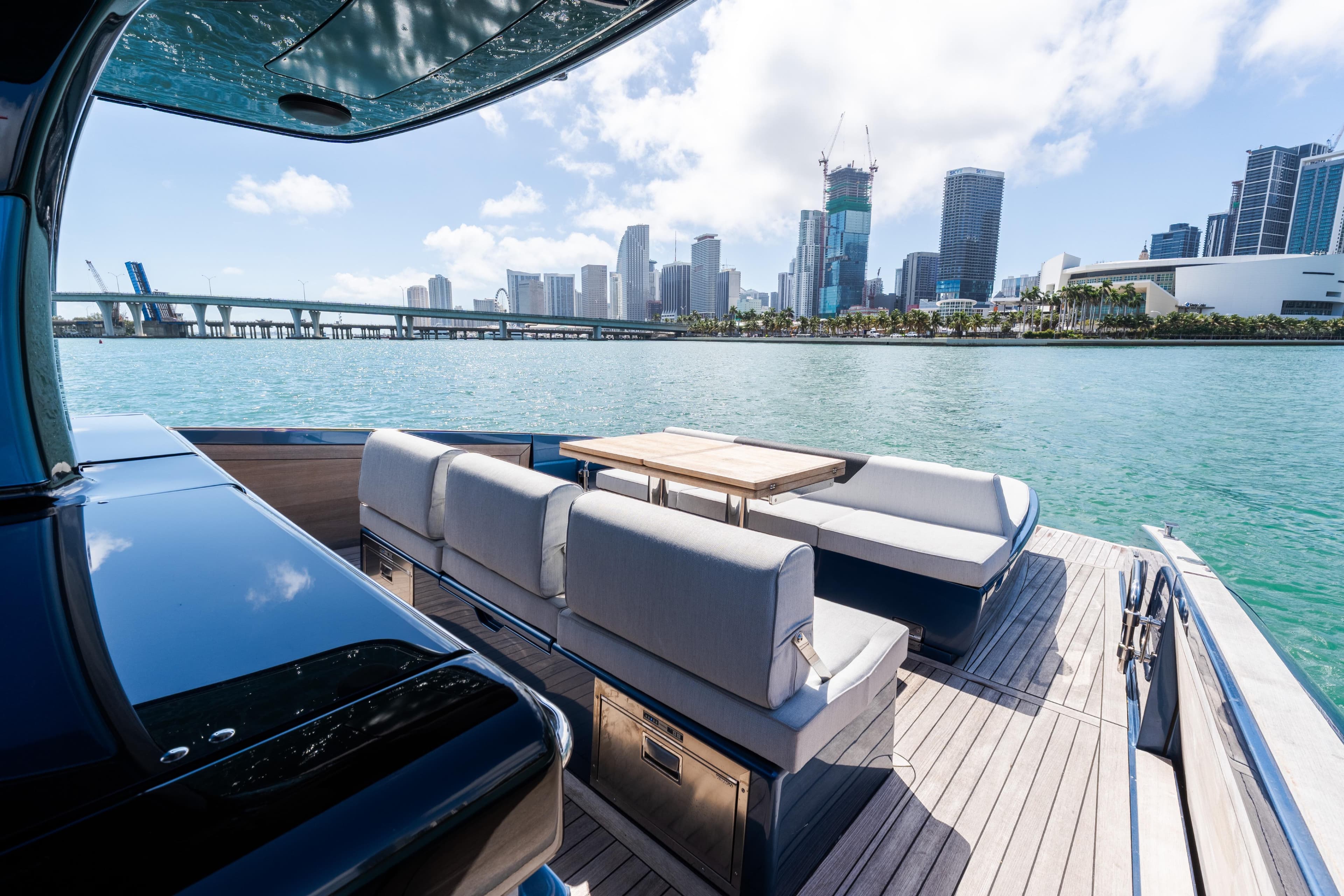 Luxurious 2023 Solaris Power 44 Open yacht with city skyline view.