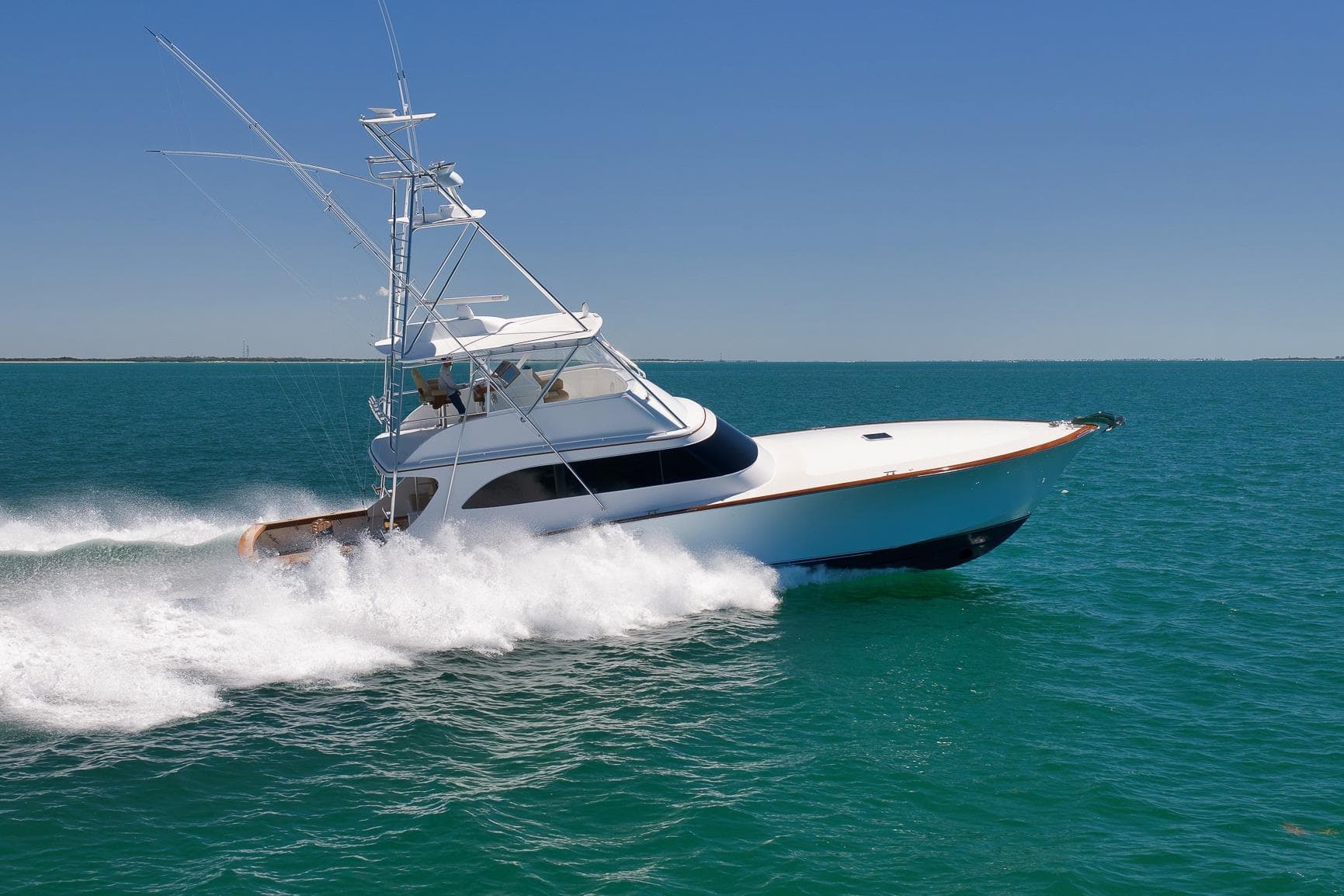 2003 Weaver Custom Sportfish yacht cruising swiftly on open blue waters.