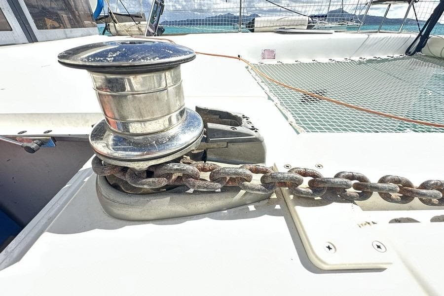 Anchor winch on 2013 Lagoon 39 catamaran deck with chain and netting.