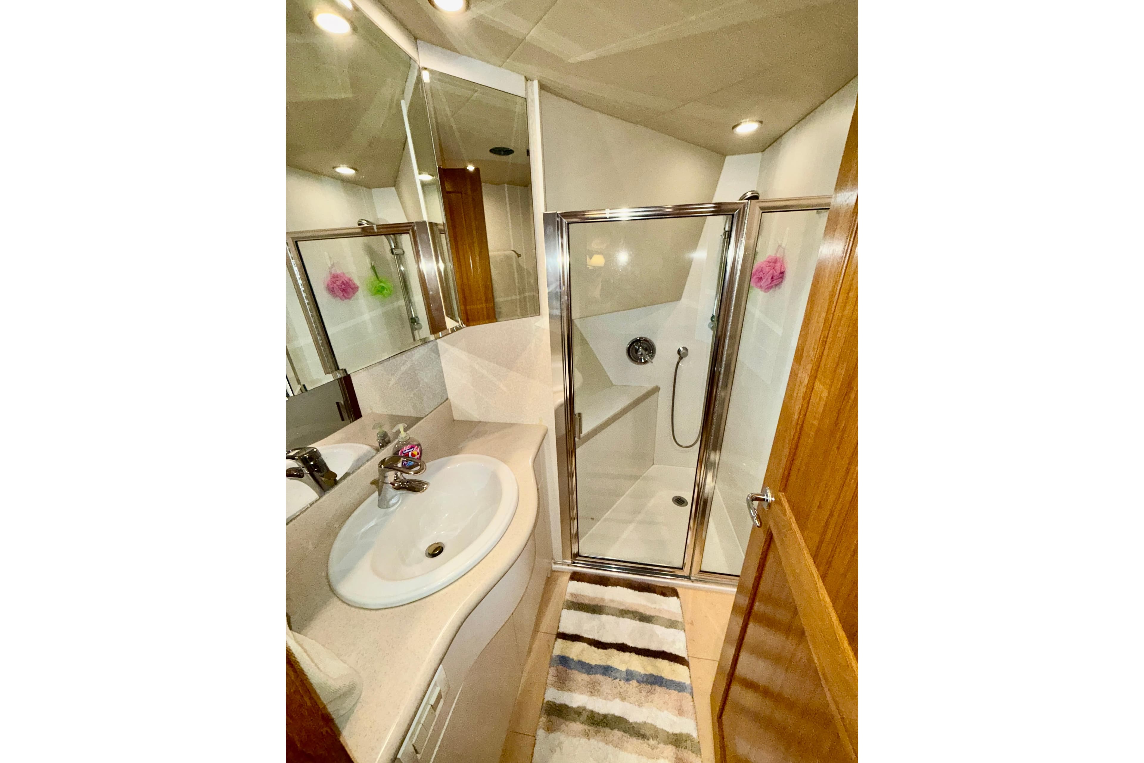 Bathroom interior of 2001 Pacific Mariner 65 Motoryacht with shower and sink.
