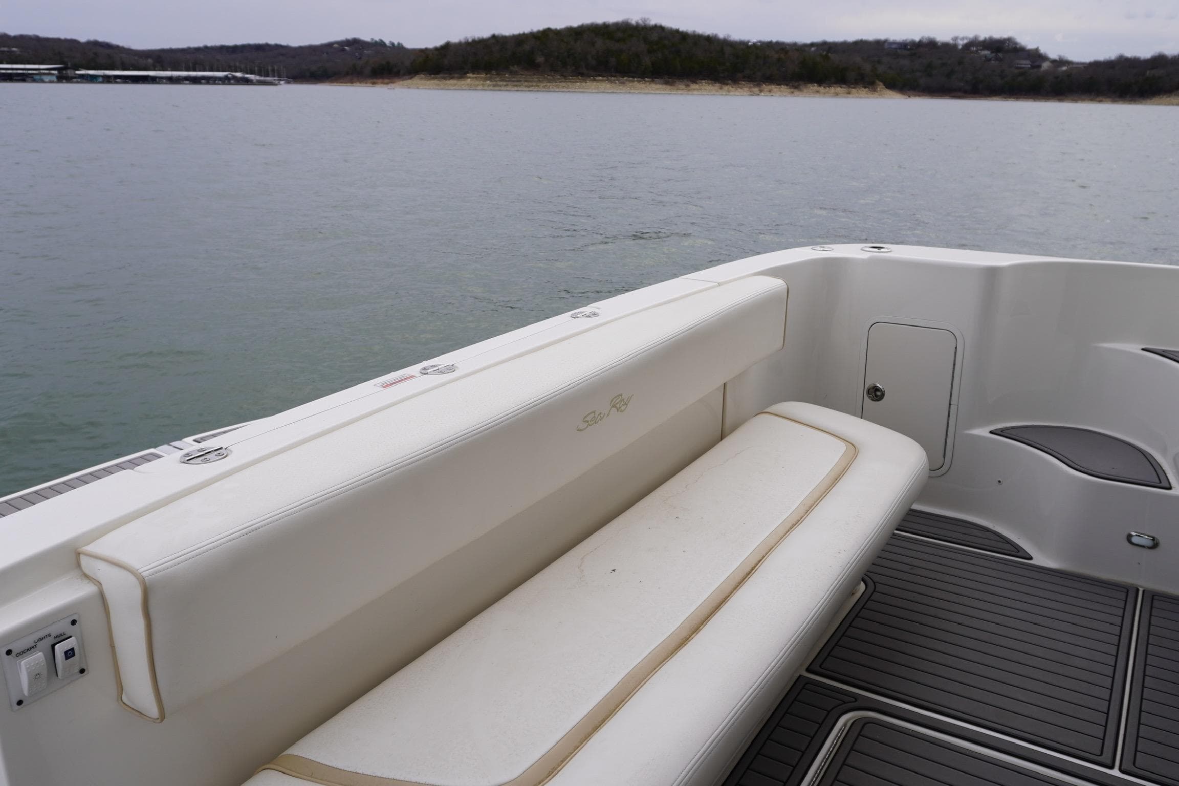 2009 Sea Ray 47 Sedan Bridge boat interior with seating, on calm water.
