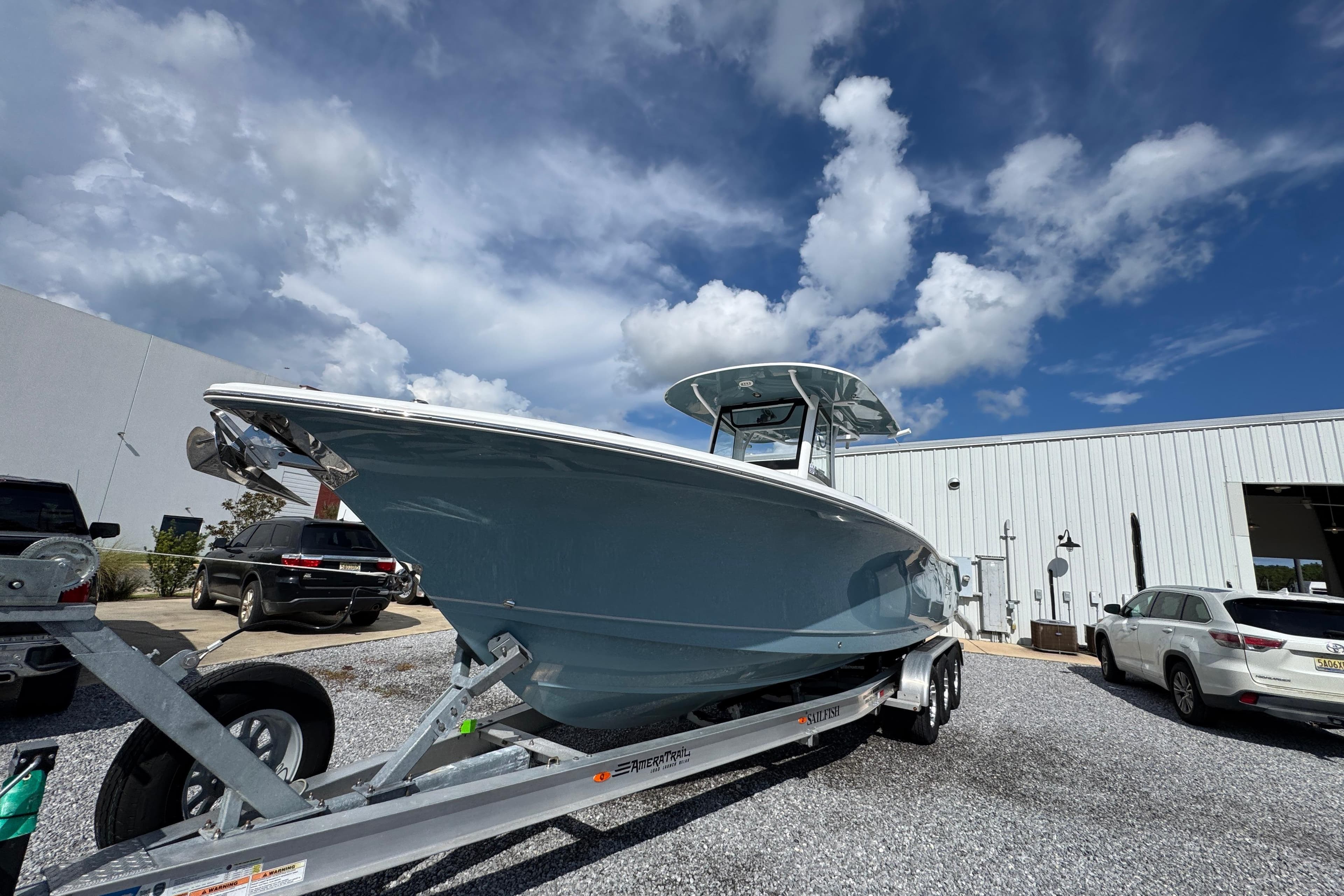 2023 Sea Hunt Gamefish 30 Coffin Box boat on trailer under blue sky.