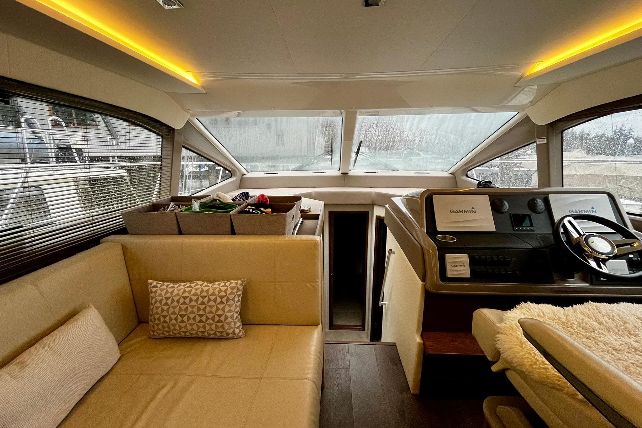 Luxurious 2019 Sea Ray Sundancer 460 yacht interior with plush seating and modern helm.