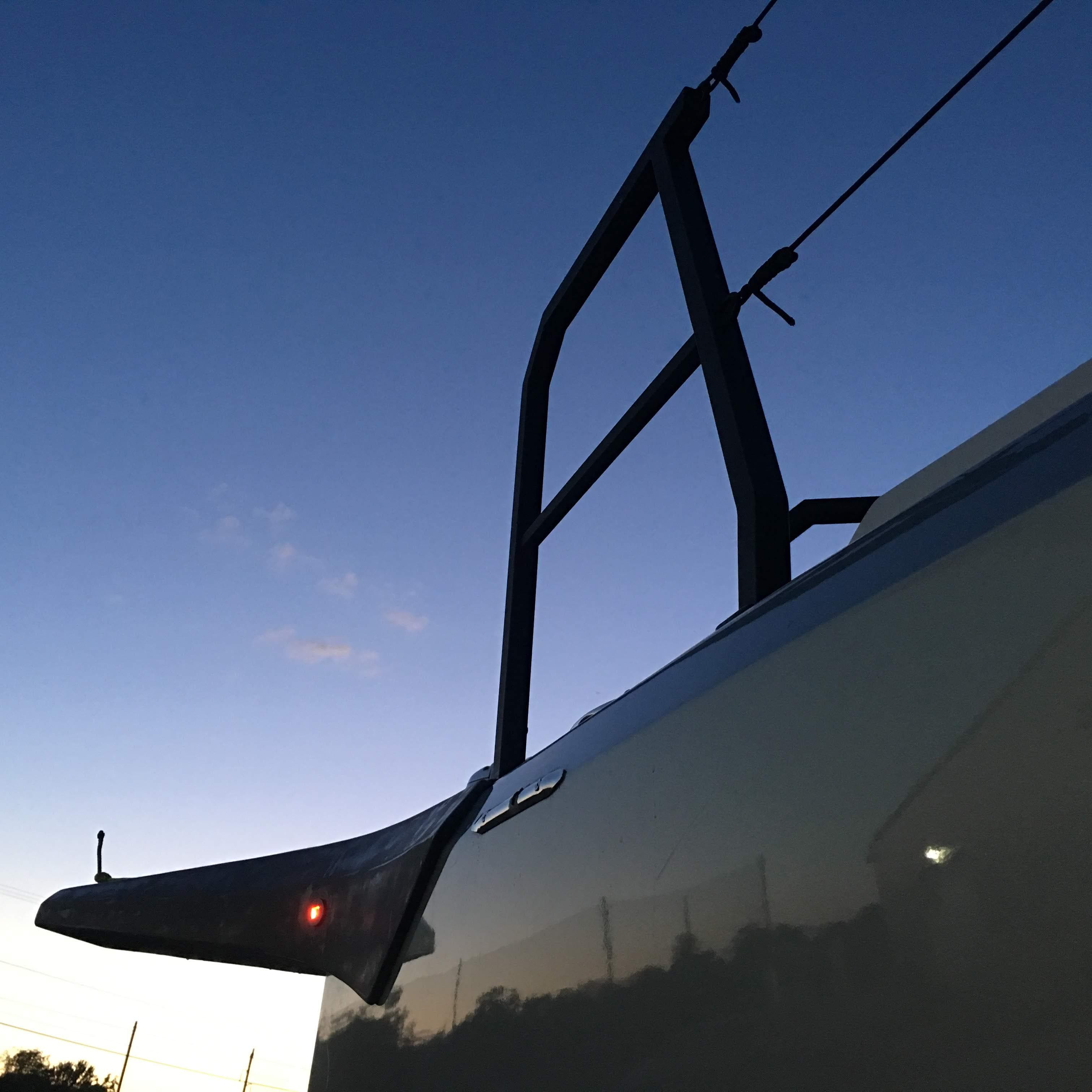 Faro Yachts 29, 2025 model, bow view at sunset with clear sky.
