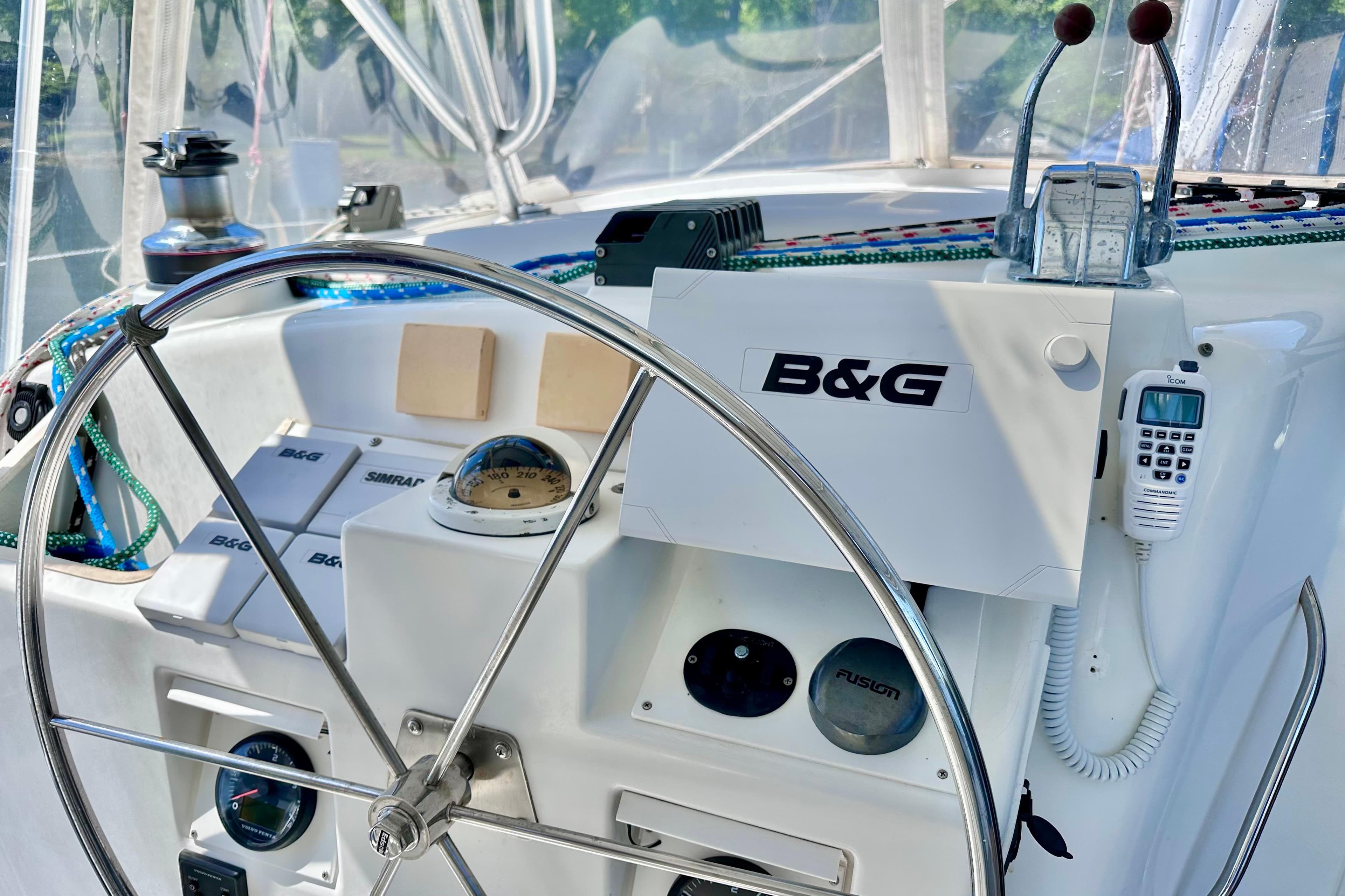 Cockpit of 1998 Manta 40 sailboat with steering wheel and navigation equipment.