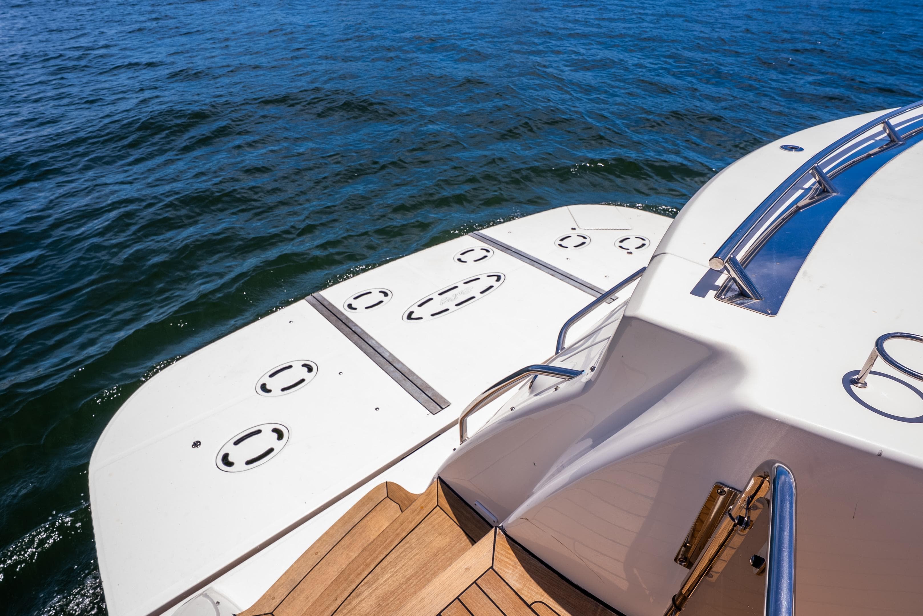 2008 Sea Ray 60 Sundancer yacht stern with swim platform on open water.