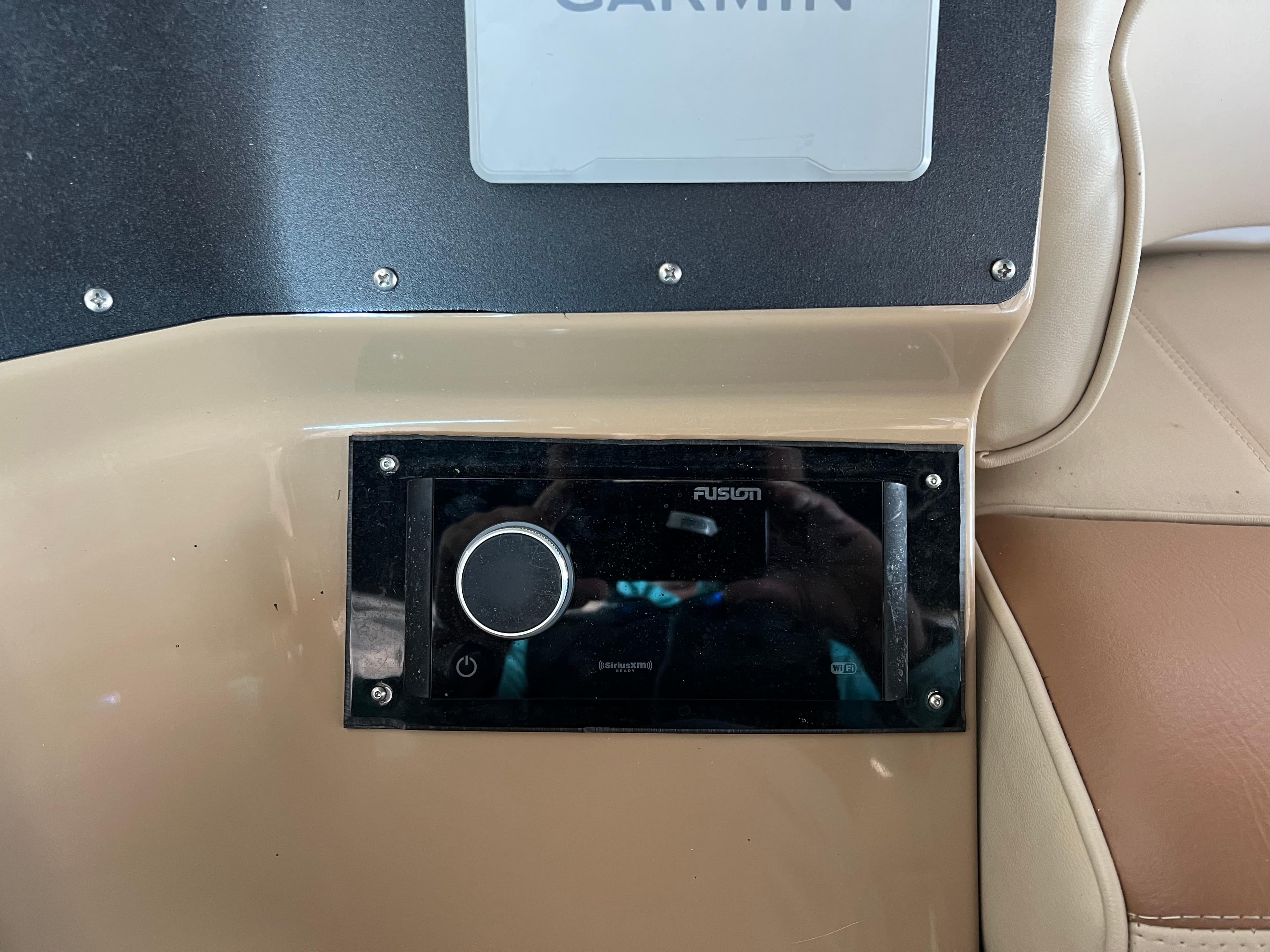 Fusion audio system on 2001 Carver 450 Voyager Pilothouse dashboard.