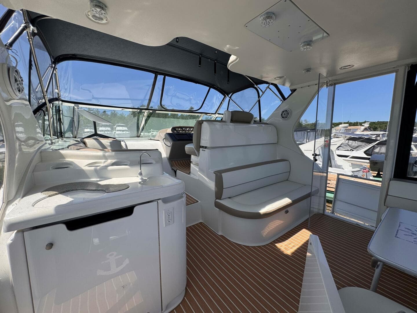 2002 Cruisers Yachts 4450 Express Motor Yacht interior with seating and helm.