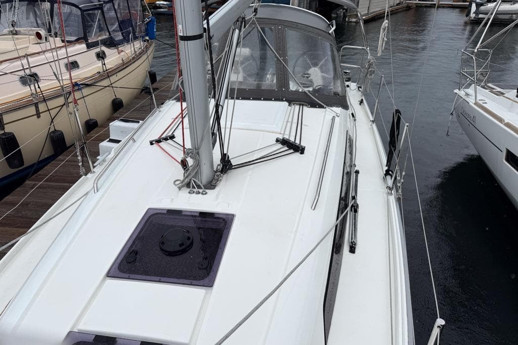 2023 Beneteau Oceanis 30.1 sailboat docked at marina, showcasing sleek deck design.