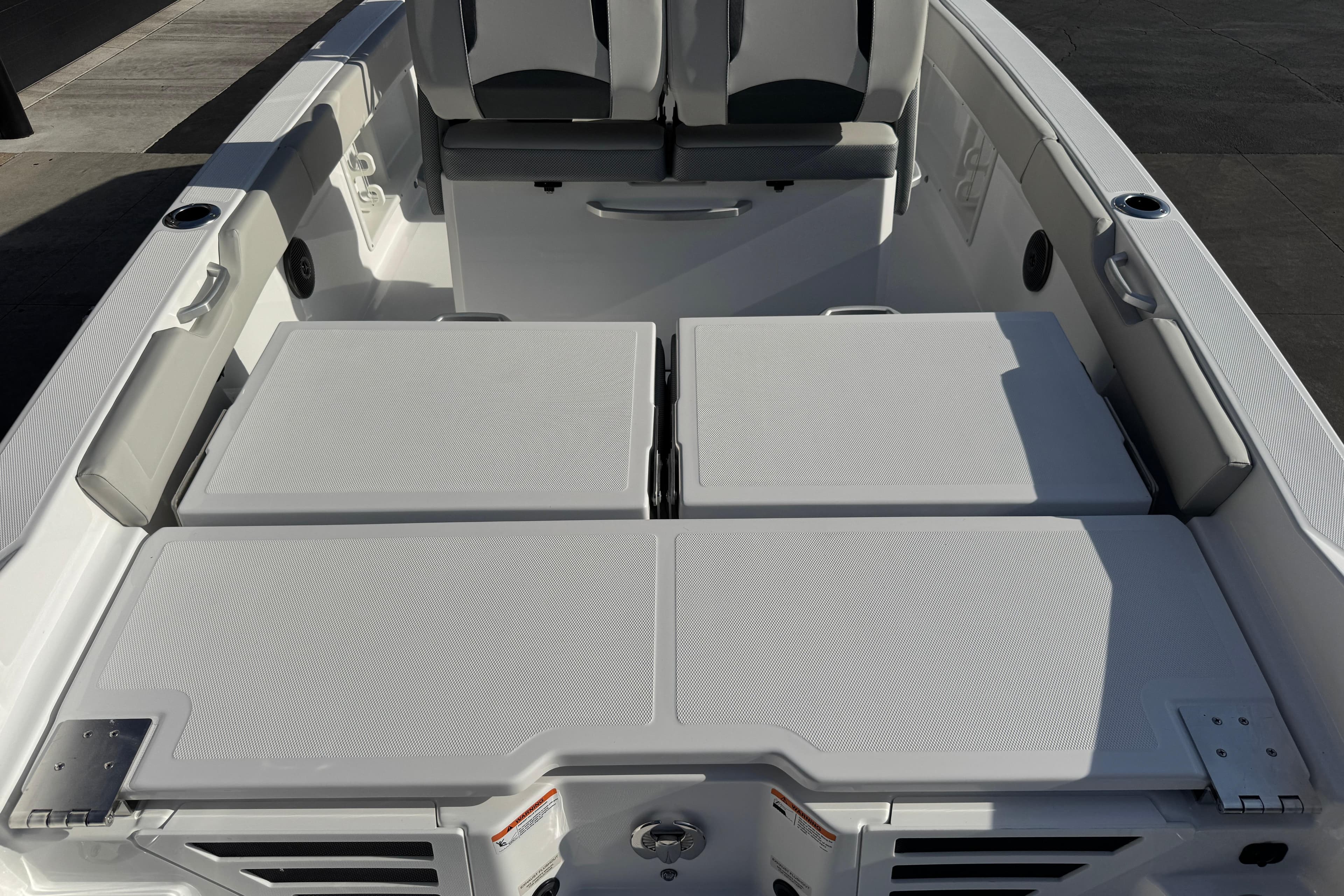 2026 Scarab 235 Open SE boat interior with cushioned seating and storage compartments.