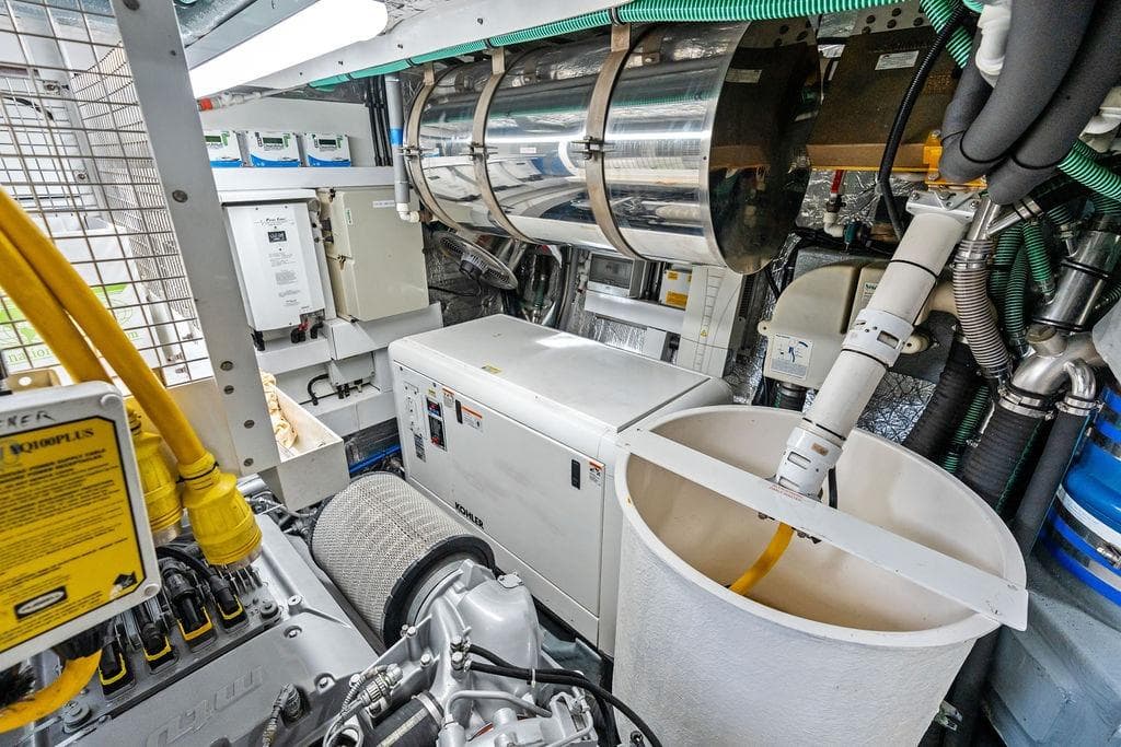 Engine room of 2012 Sunseeker 88 Yacht with mechanical equipment and wiring.