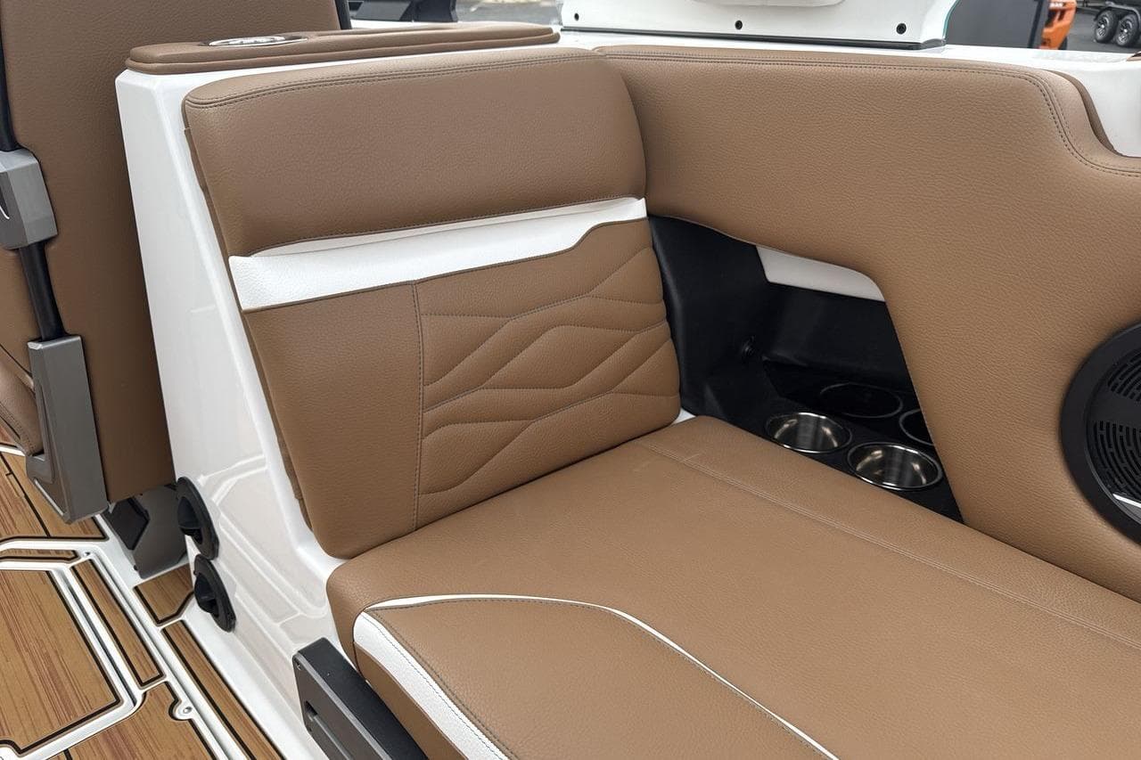 2026 Supra SV interior with brown leather seating and cup holders.