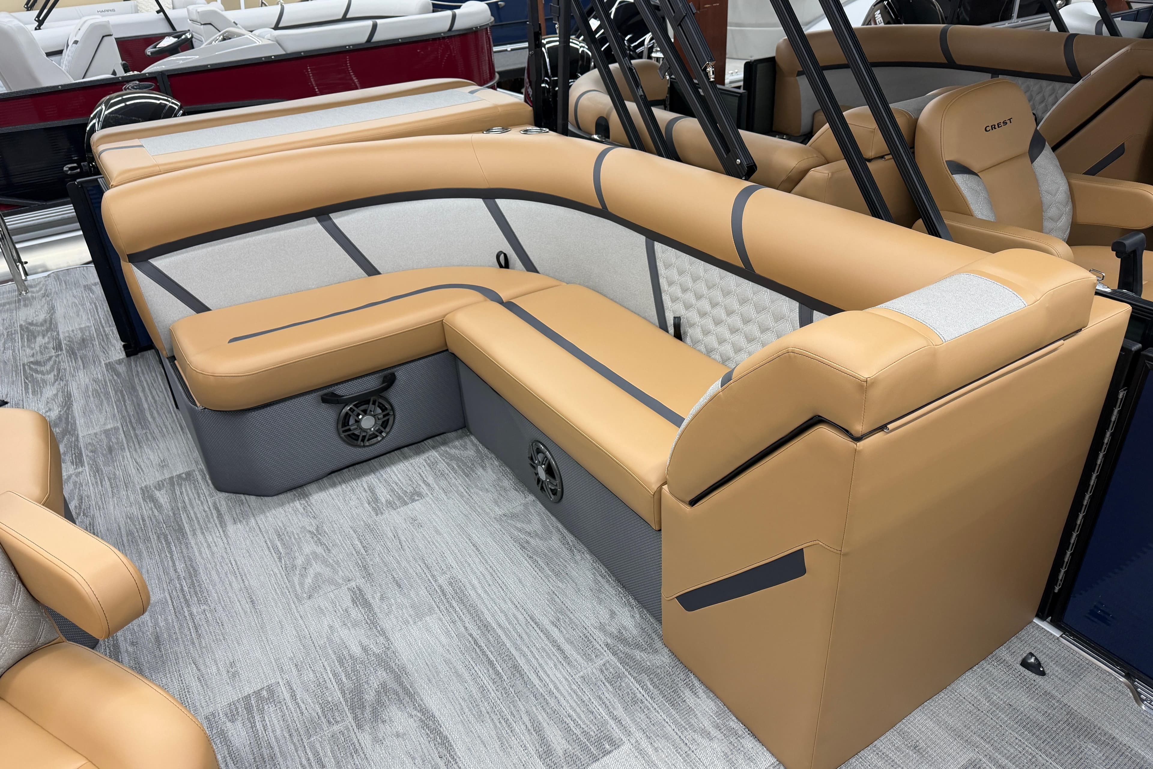 Luxurious seating on 2025 Crest Classic 220 boat, featuring tan upholstery and modern design.