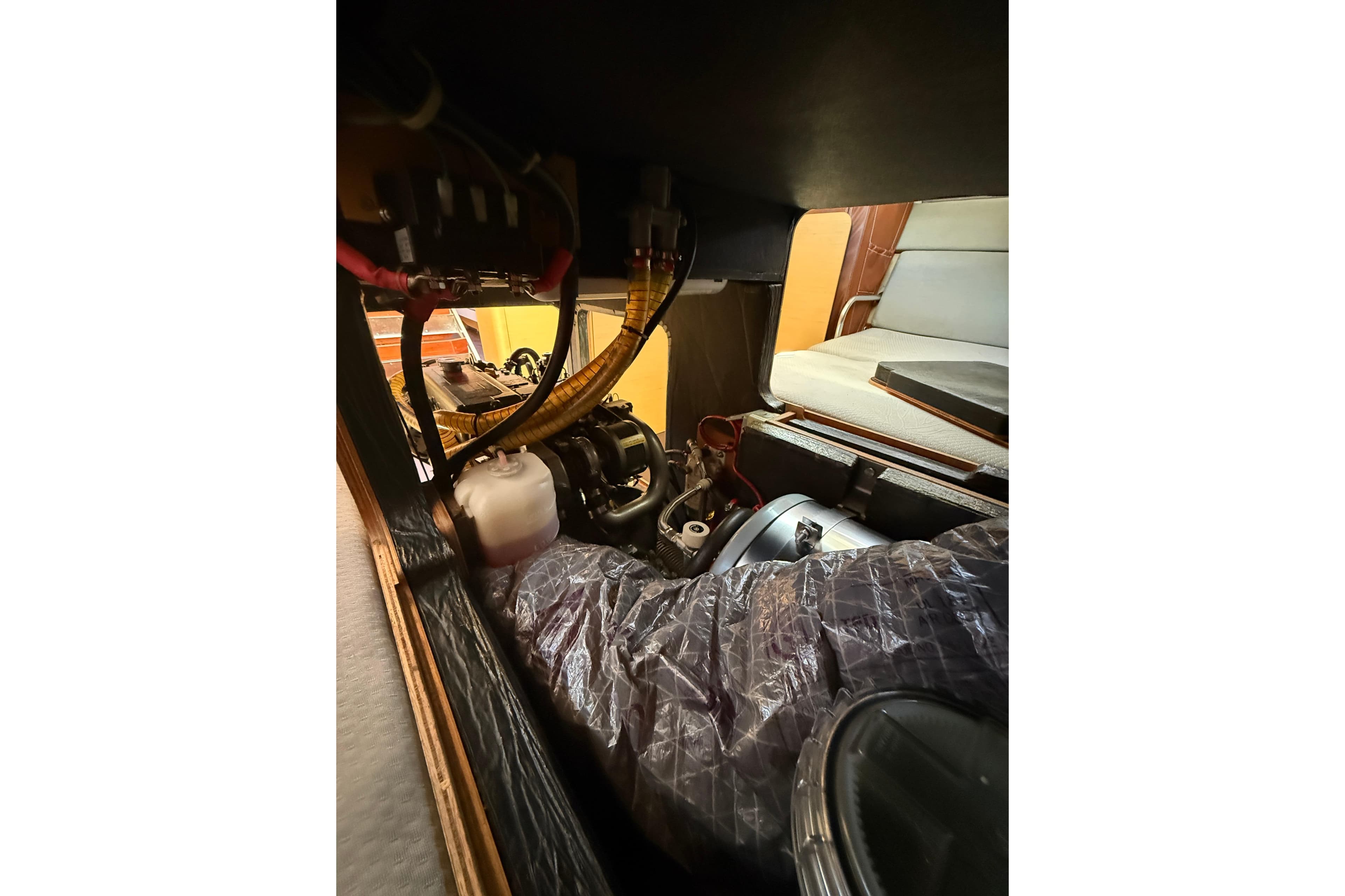 Engine compartment of a 2008 Beneteau First 50 sailboat, showcasing mechanical components.
