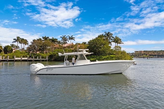 2020 Yellowfin 39 Center Console boat on a scenic waterway with palm trees.
