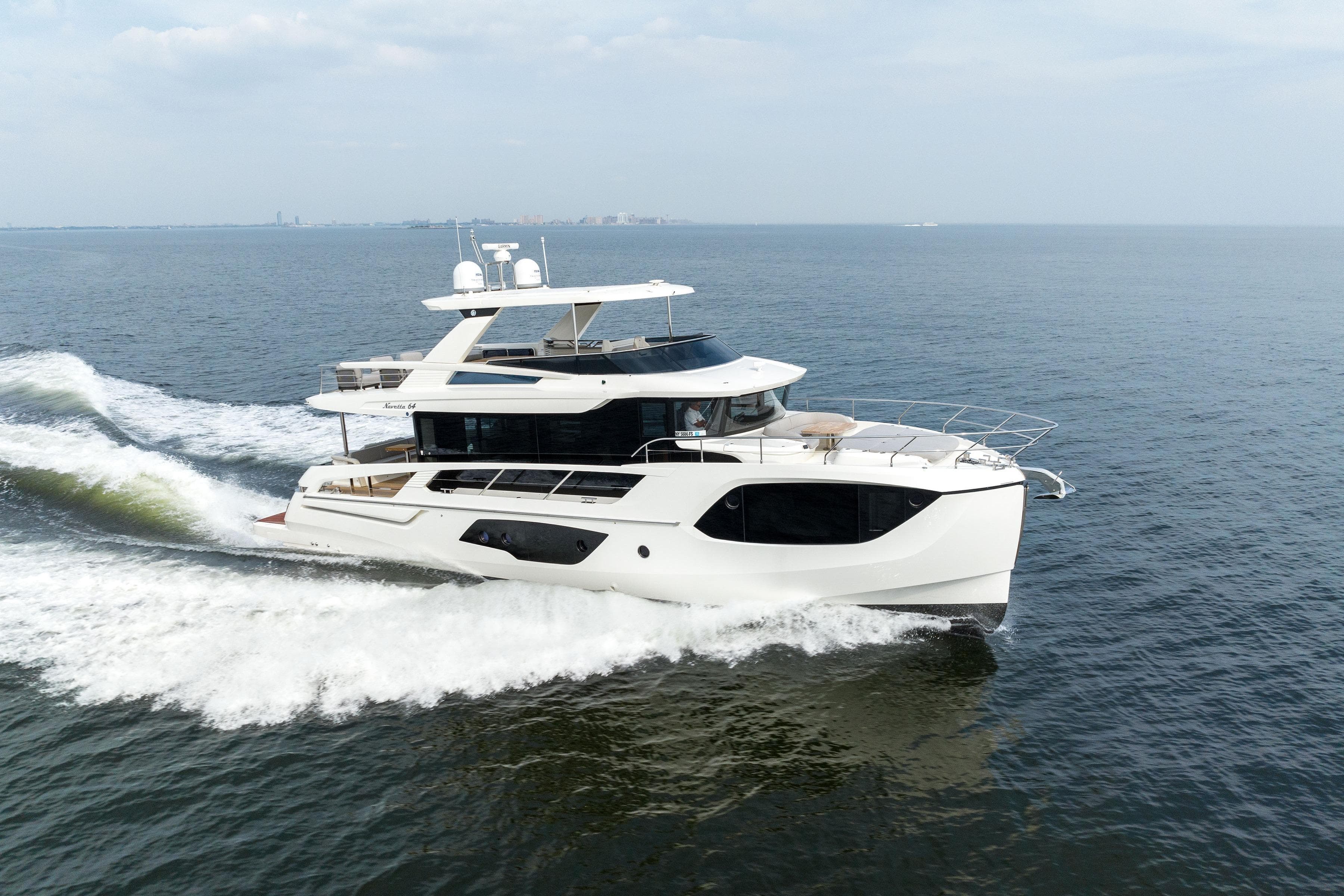 2024 Absolute Navetta 64 yacht cruising on open water.
