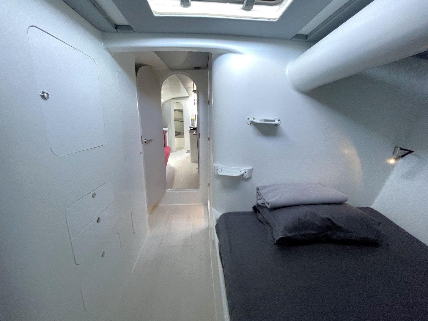 Interior of 2002 Bakewell-White 20m Pocket Maxi yacht, featuring a minimalist cabin design.