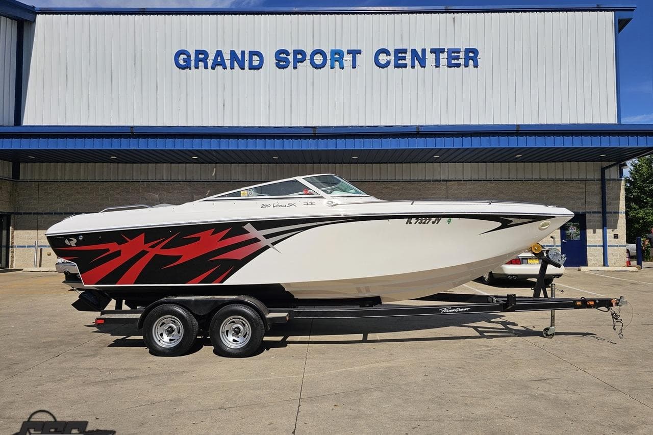 2006 Powerquest 240 Ultra LX boat on trailer at Grand Sport Center.