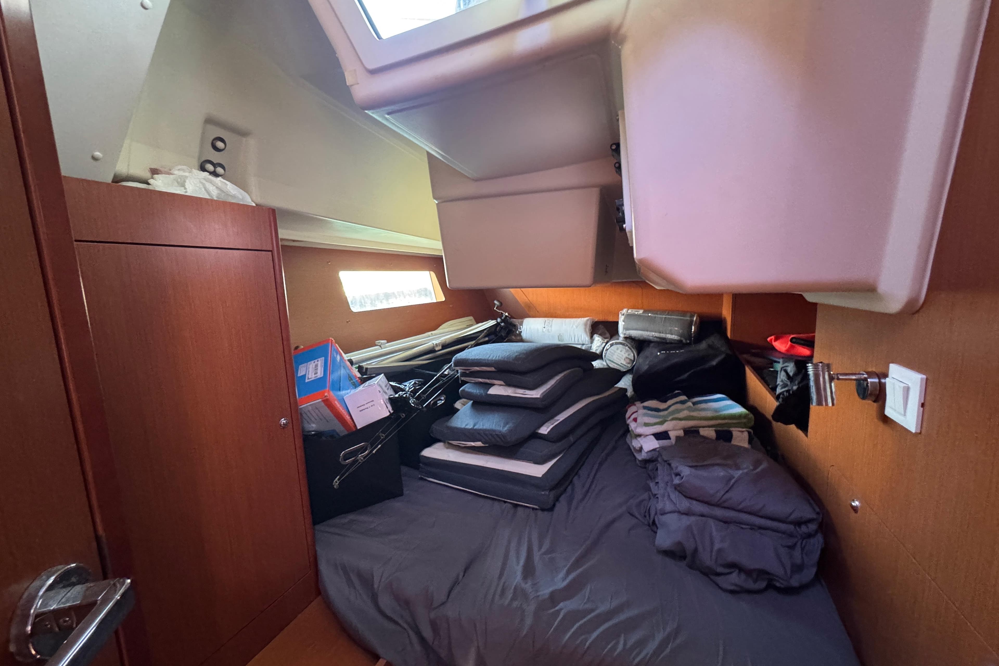 Cozy cabin interior of 2017 Beneteau Oceanis 41.1 yacht with storage and bedding.