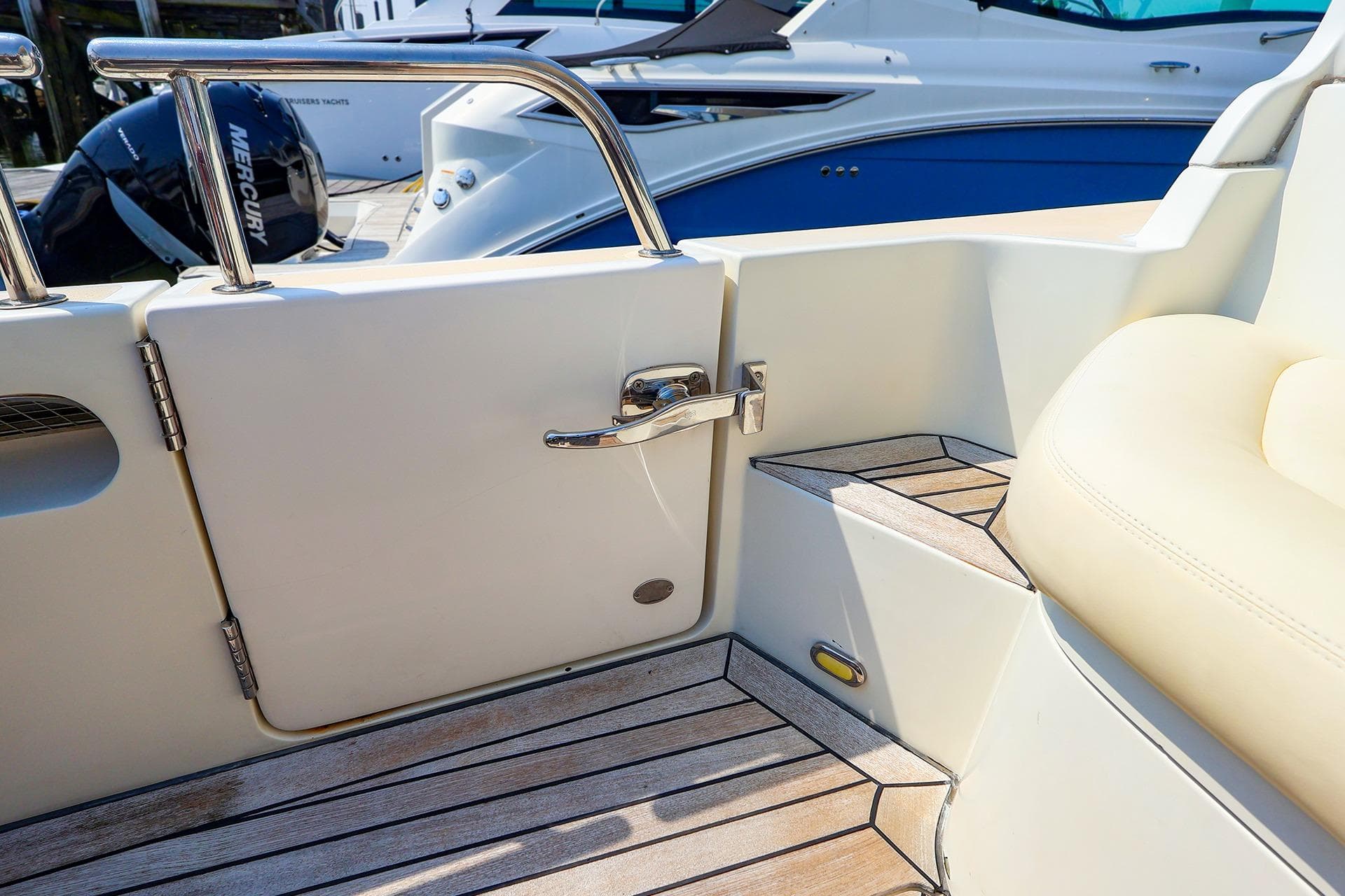 MJM 40z Downeast 2010 boat interior with teak flooring and stainless steel details.