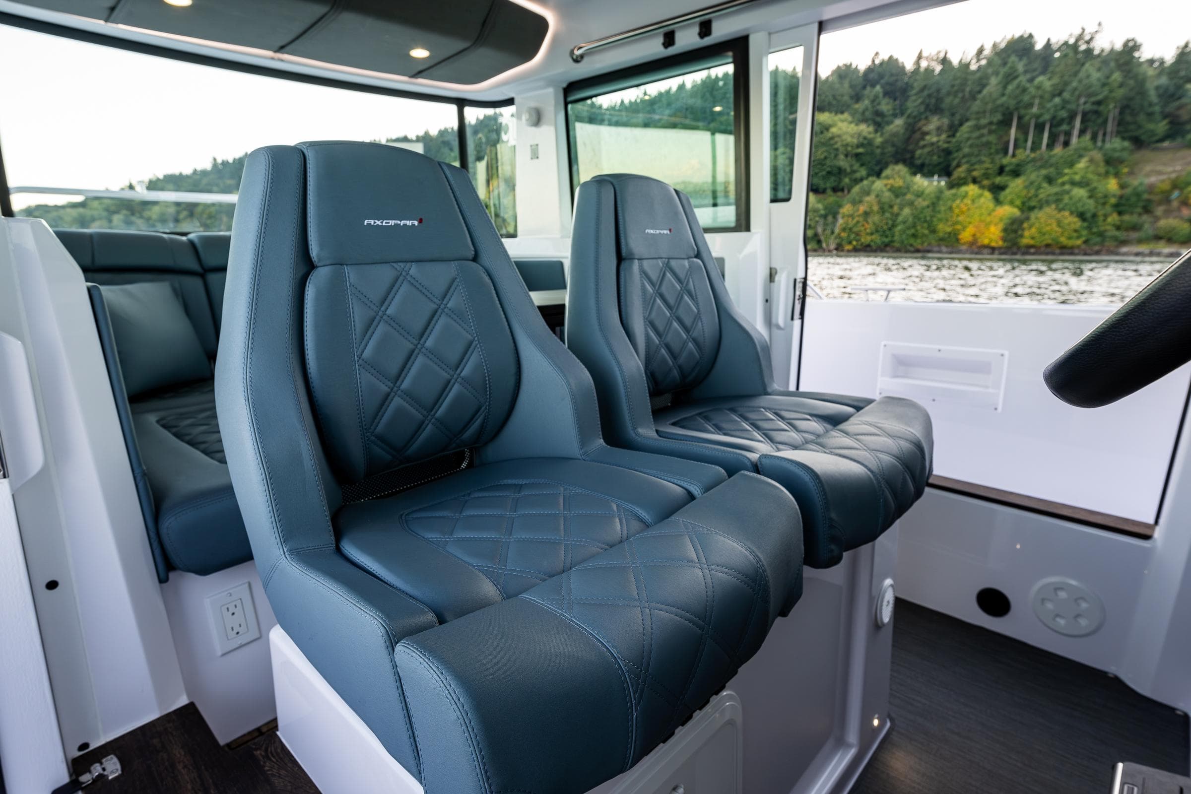 Luxurious interior seating of 2022 Axopar 37 XC boat with quilted leather design.