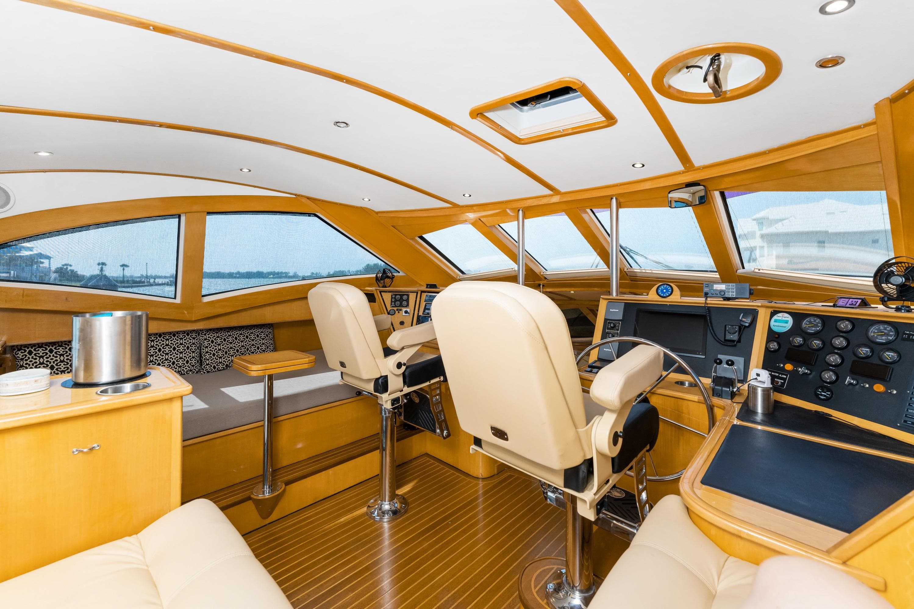 Luxurious interior of 2000 Jutson 46 LRC yacht with modern helm and seating.