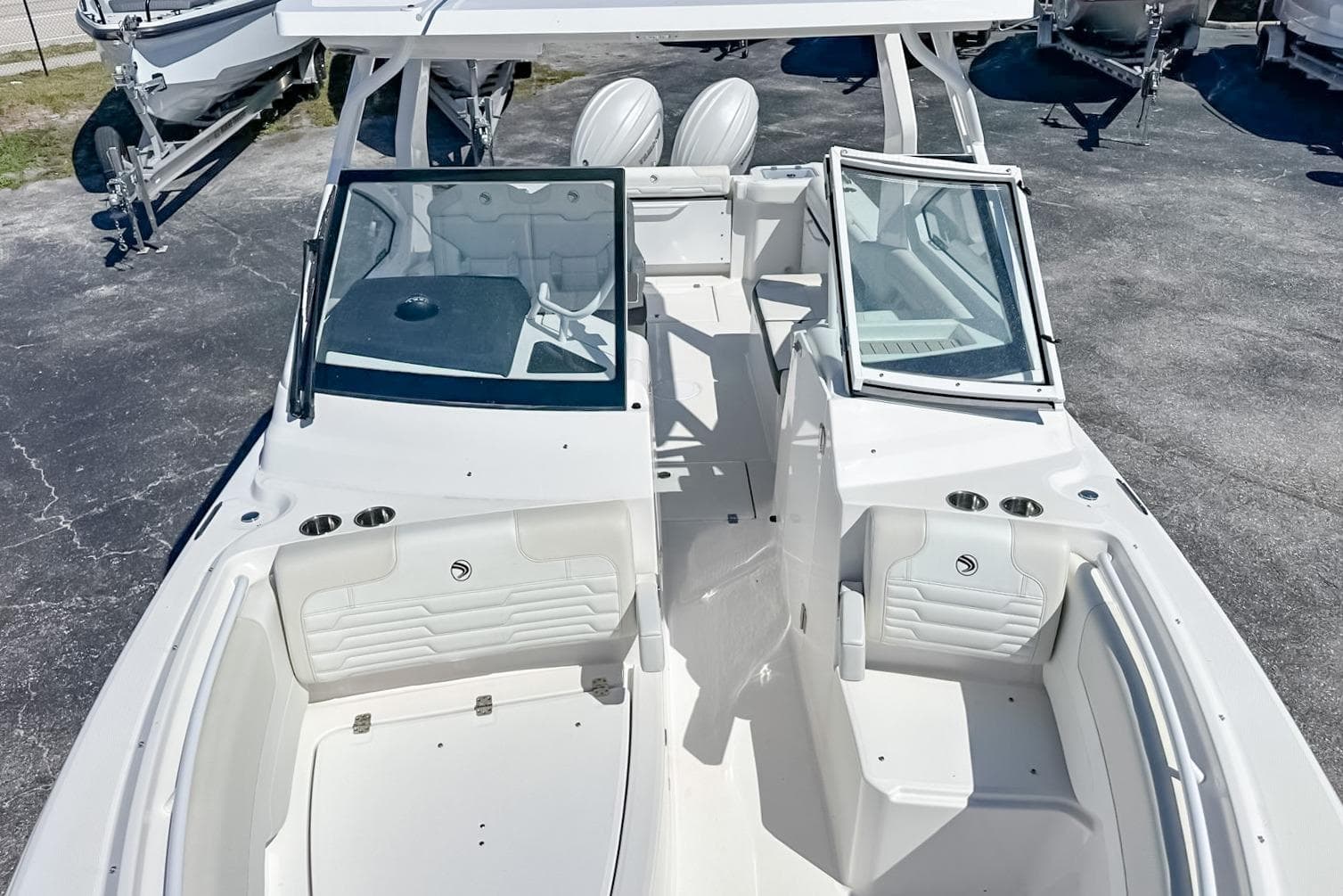 2025 Edgewater 262CX Crossover boat interior with seating and open windshield.